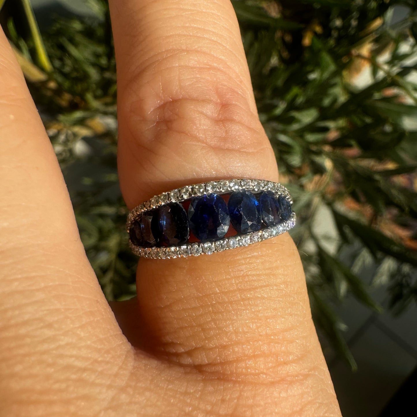 18K gold ring set with a row of deep blue Sapphire & Diamonds
