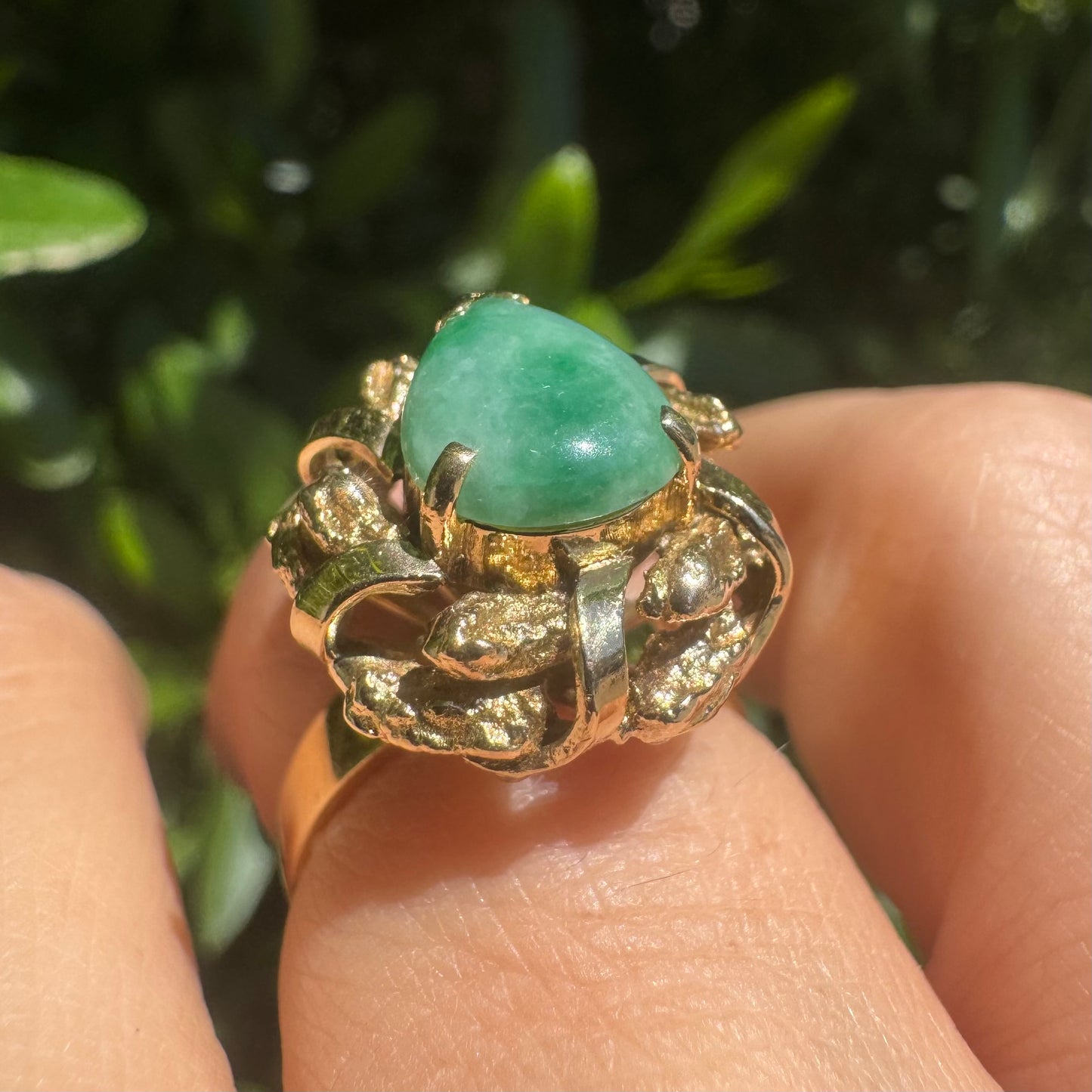 14K gold ring set with a pear-shaped Jade cabochon