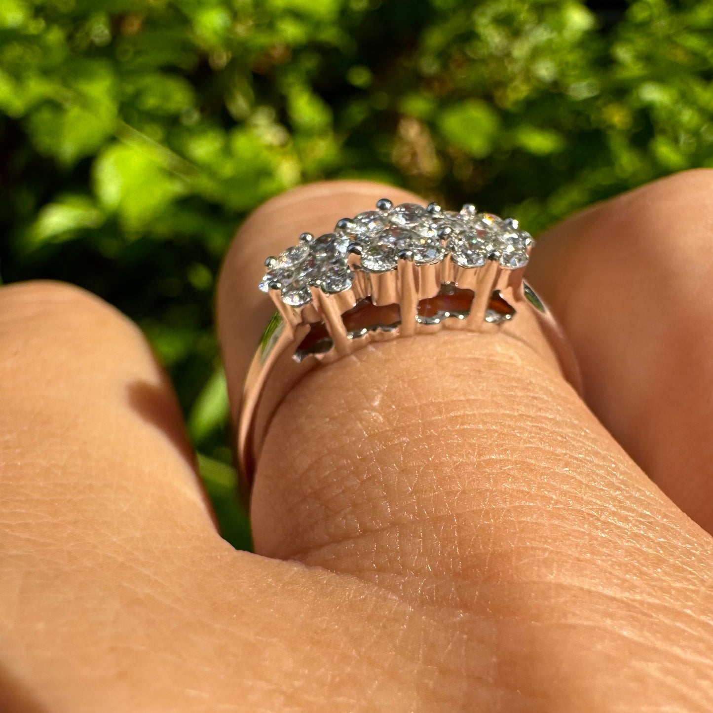 14K white gold ring set with clusters of brilliant white Diamonds