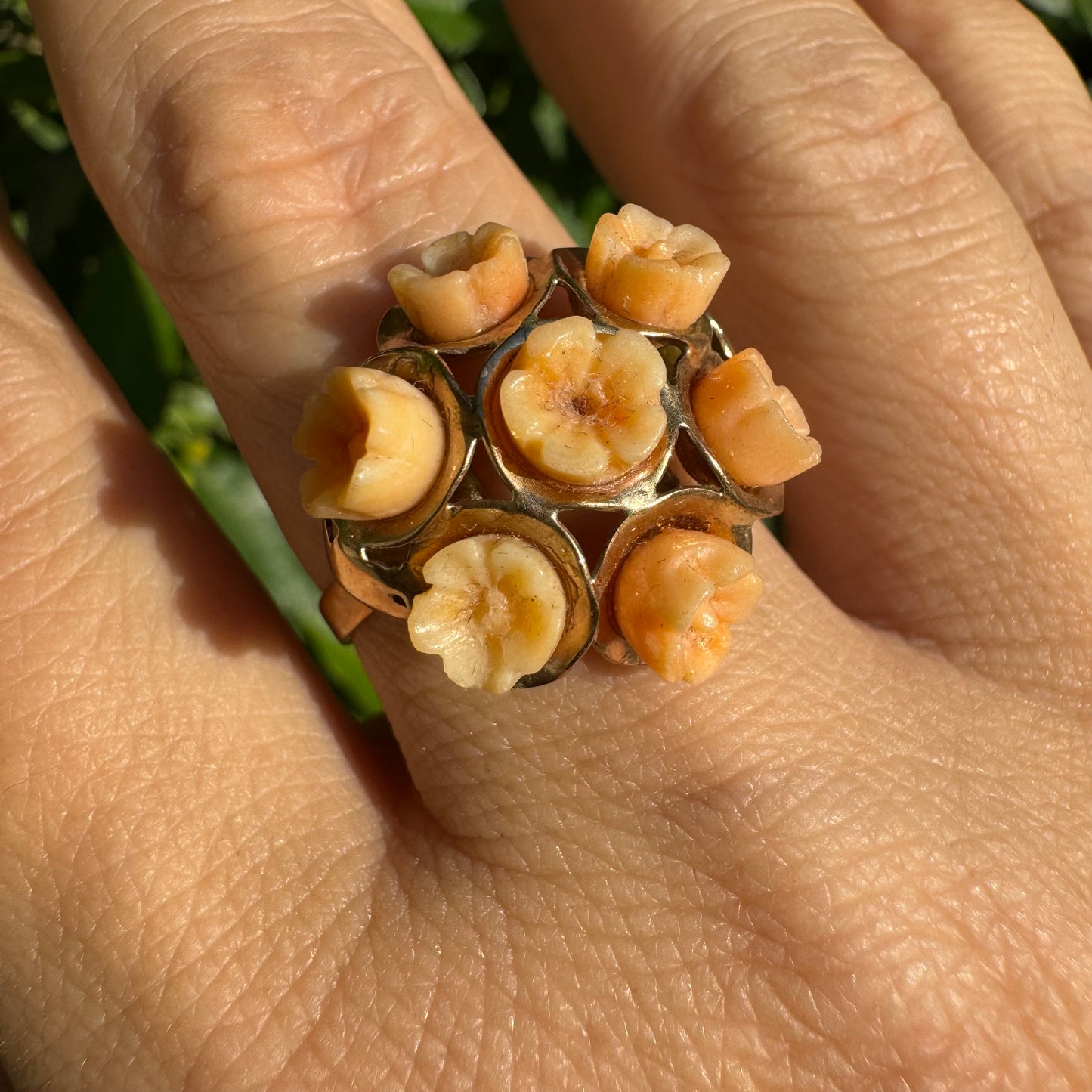 9K gold ring featuring a cluster design with carved Coral flowers in warm orange tones