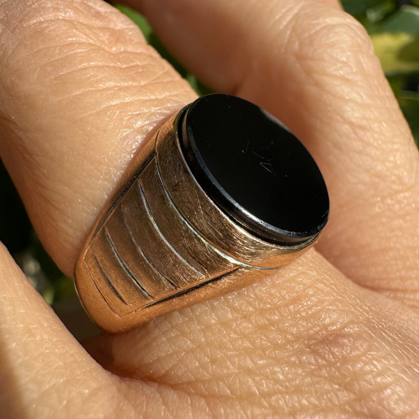 14K gold signet ring crafted in yellow gold, set with a smooth Black Onyx.