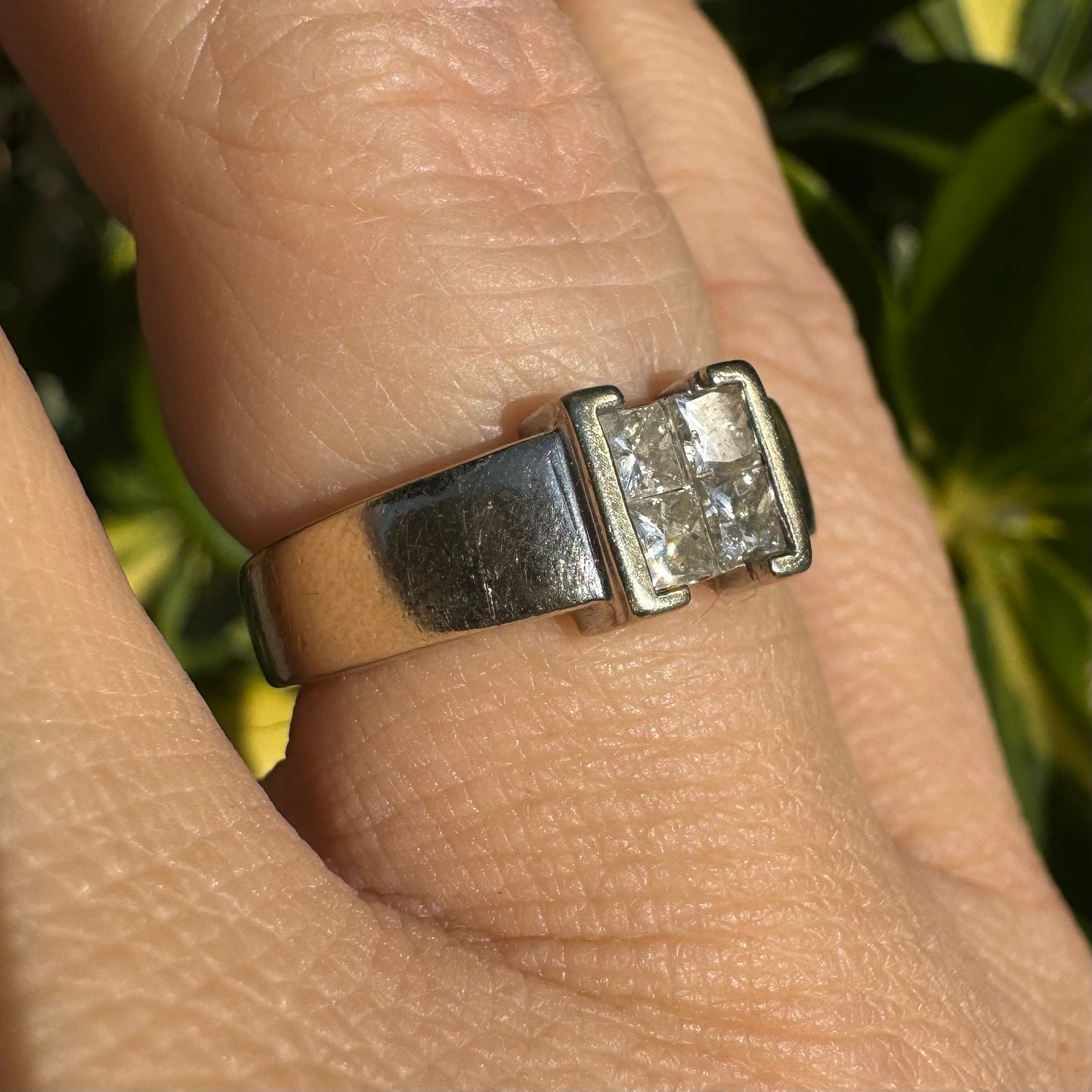 14K gold ring set with 4 square-cut Diamonds