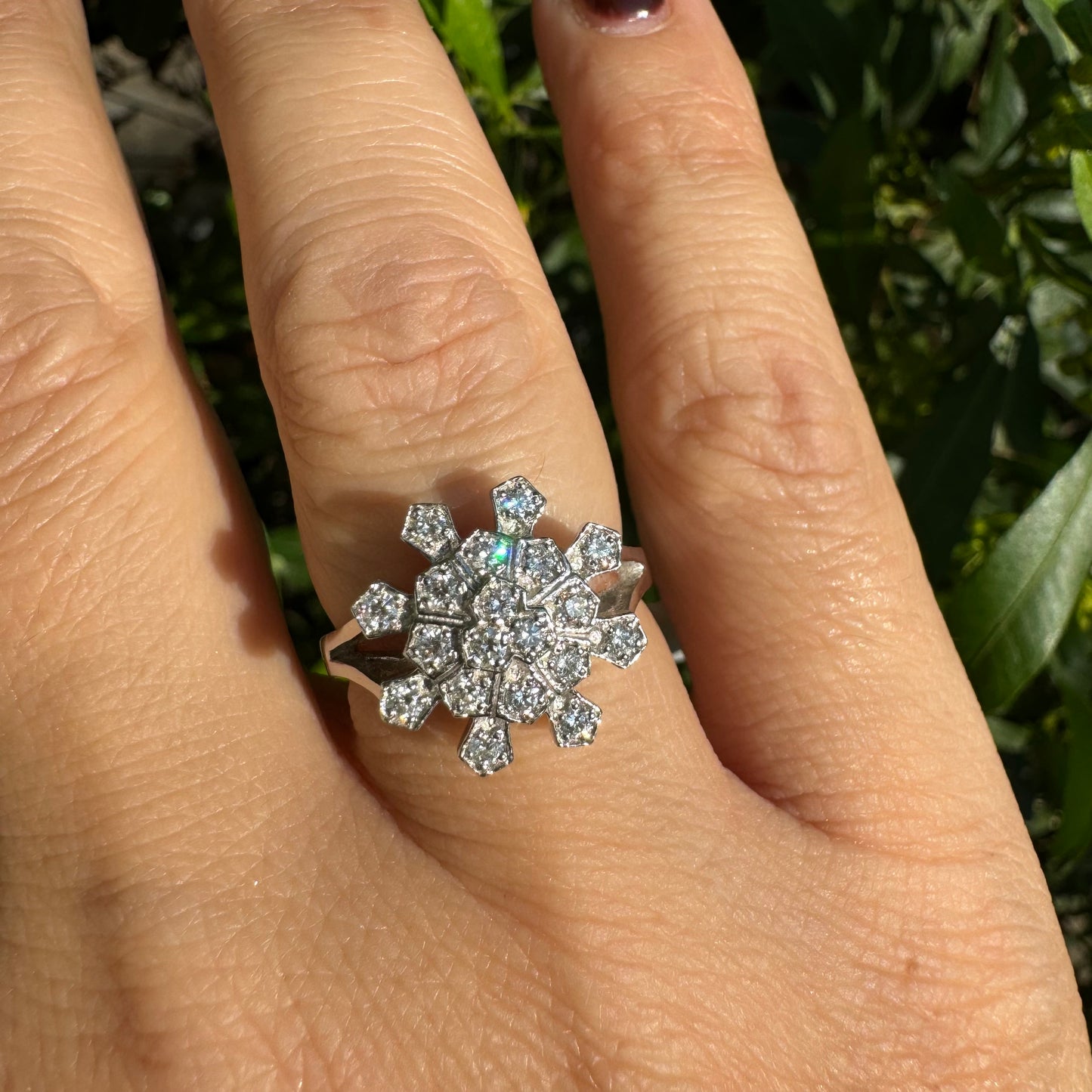 14K white gold ring set with Diamonds in a floral geometric pattern