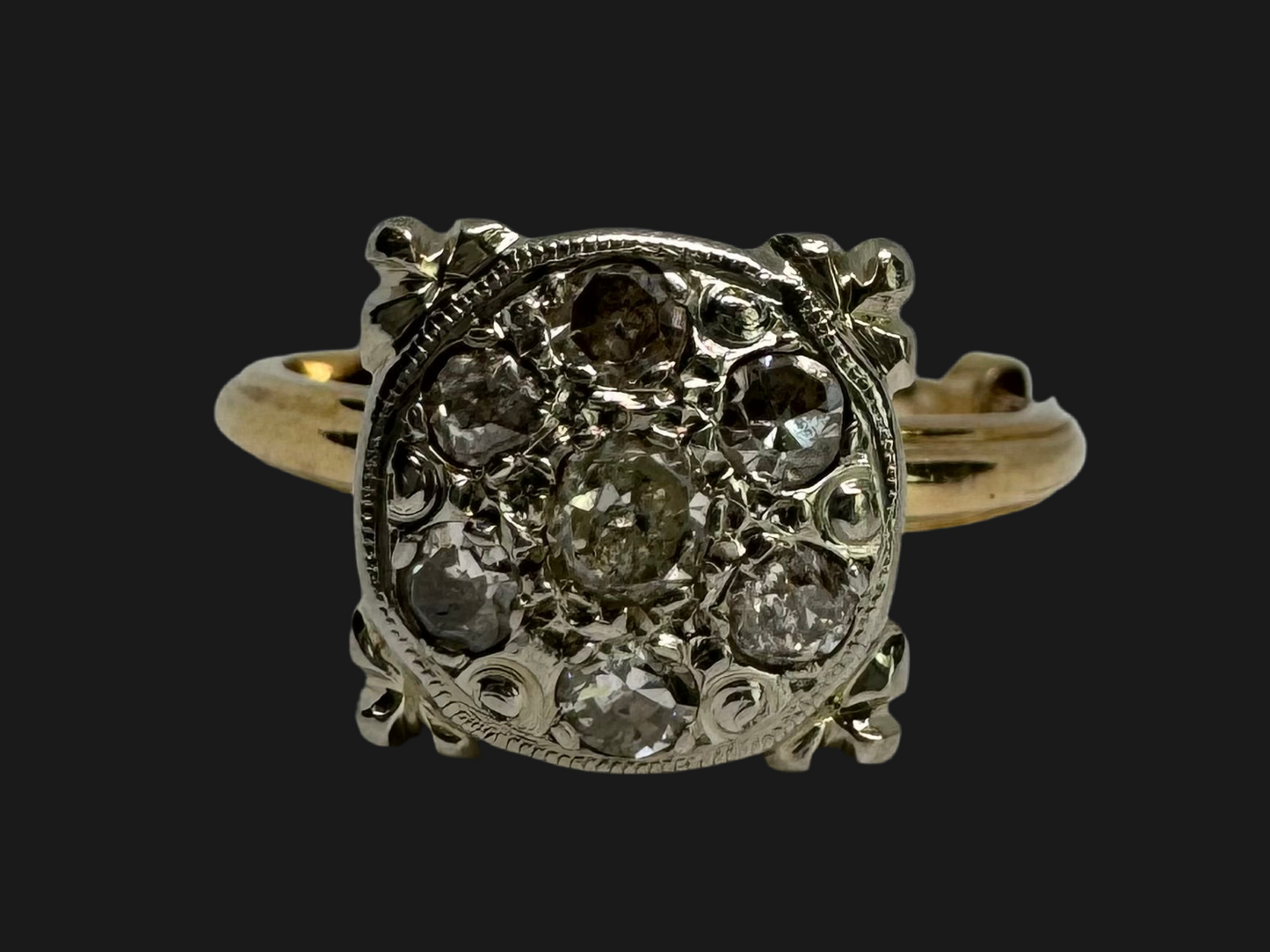 14K gold ring set with an old-cut Diamond at its center, encircled by a pavé cluster of smaller Diamonds in a round, ornate setting.