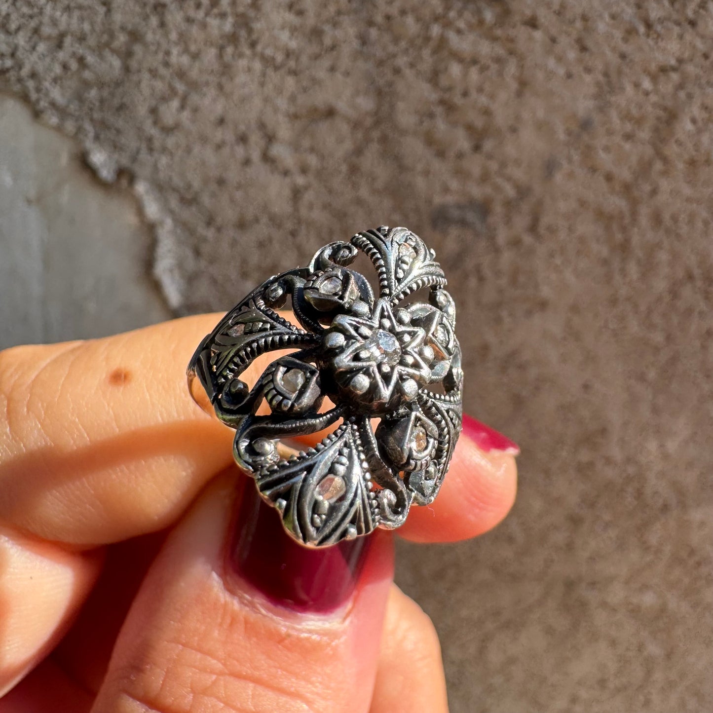 18K gold & silver ring with an intricate floral and leaf filigree design set with Diamonds