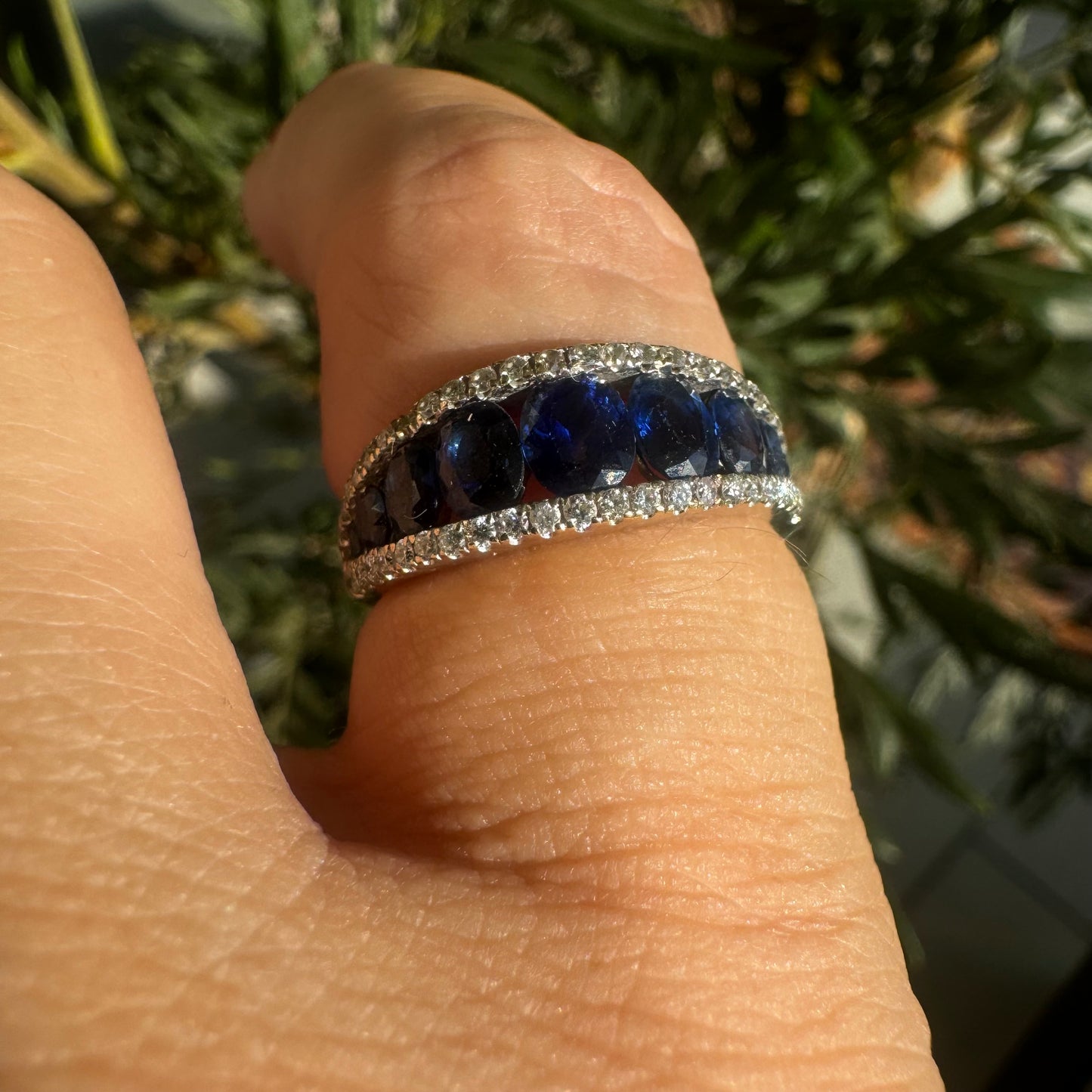 18K gold ring set with a row of deep blue Sapphire & Diamonds