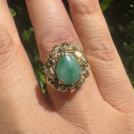 14K gold ring set with a pear-shaped Jade cabochon