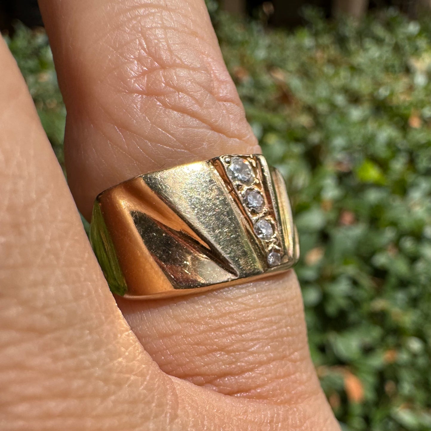 14K gold ring set with Diamonds featuring a fan-like geometric design