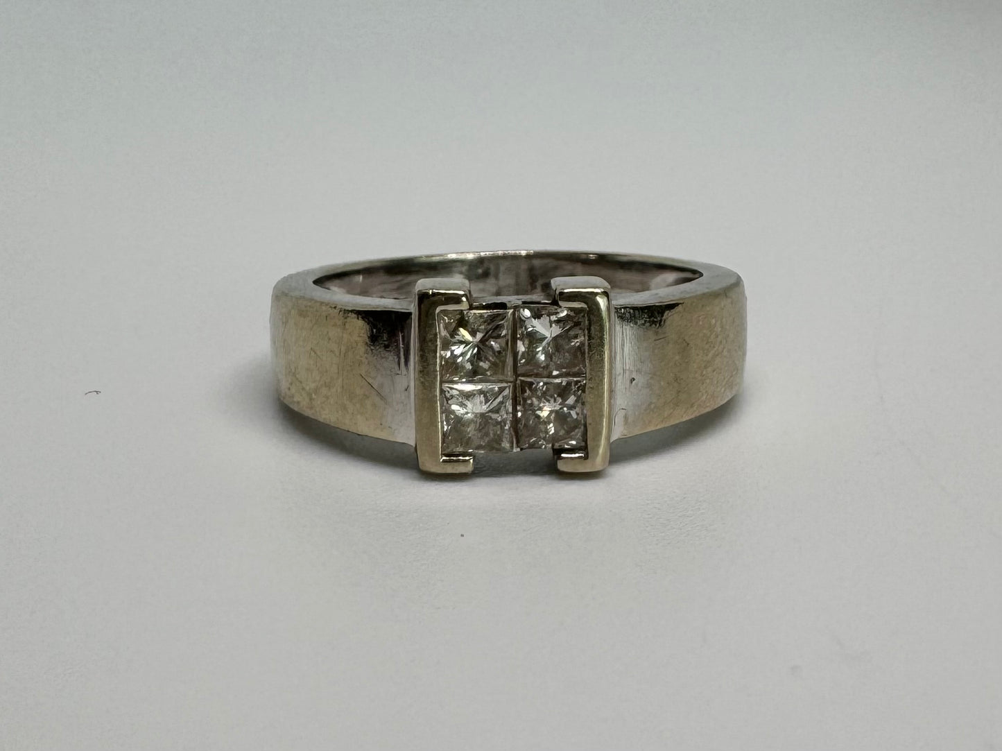 14K gold ring set with 4 square-cut Diamonds