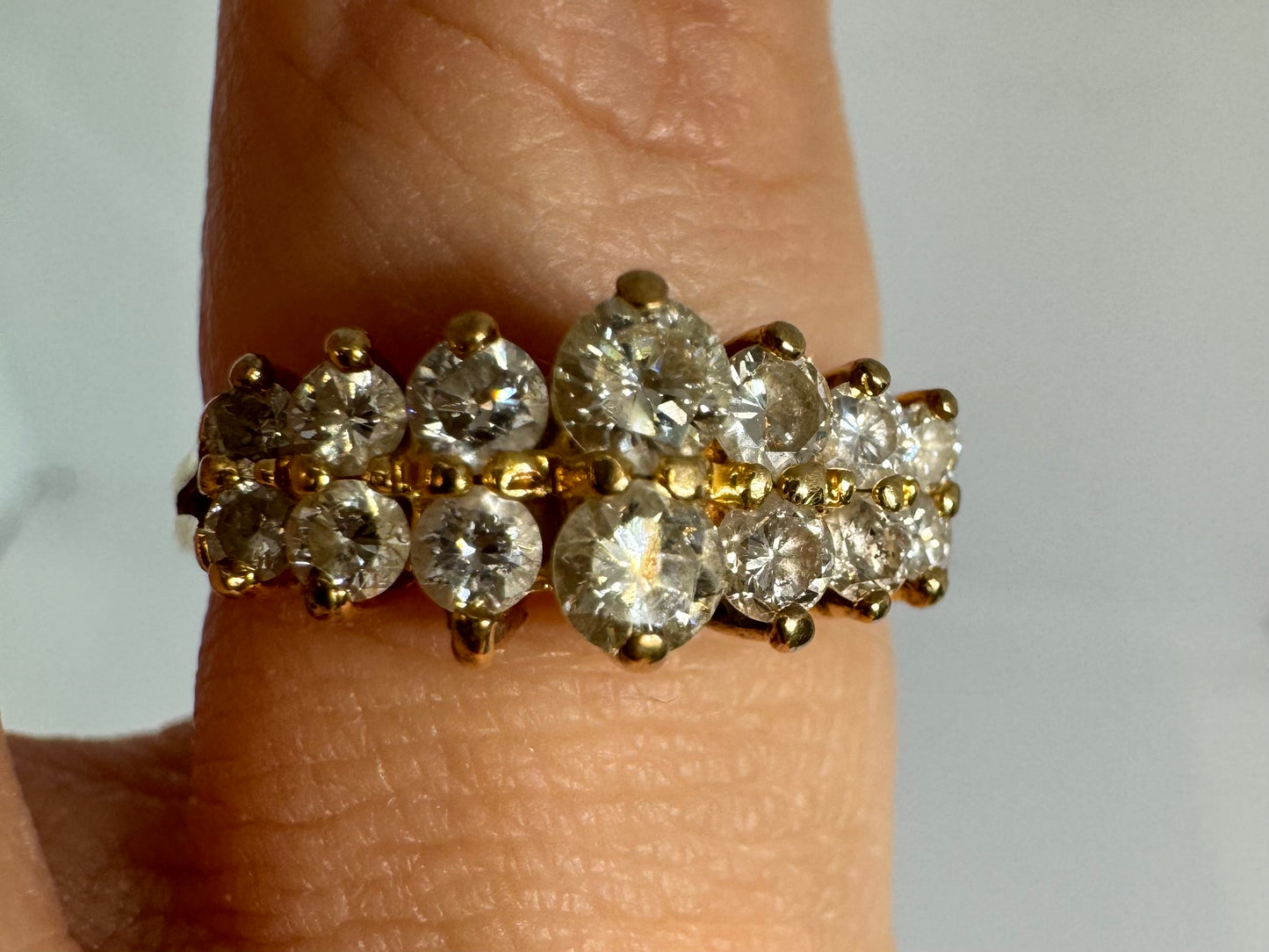 14K gold ring set with two dazzling rows of round-cut Diamonds