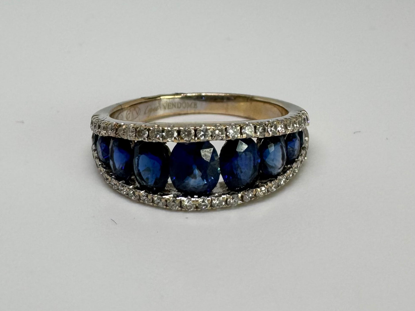 18K gold ring set with a row of deep blue Sapphire & Diamonds