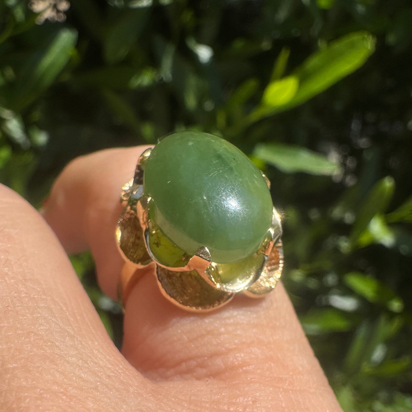 14K gold ring set with a large green Jade cabochon