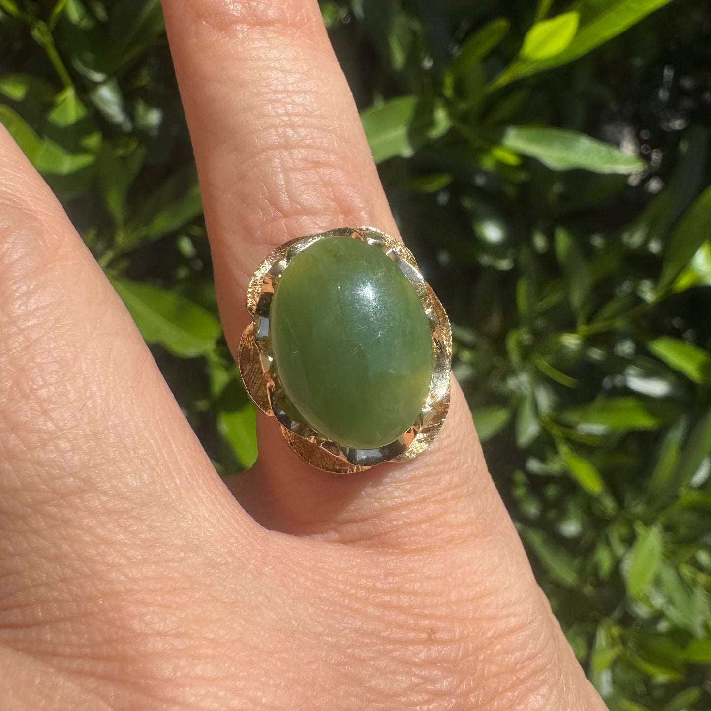 14K gold ring set with a large green Jade cabochon