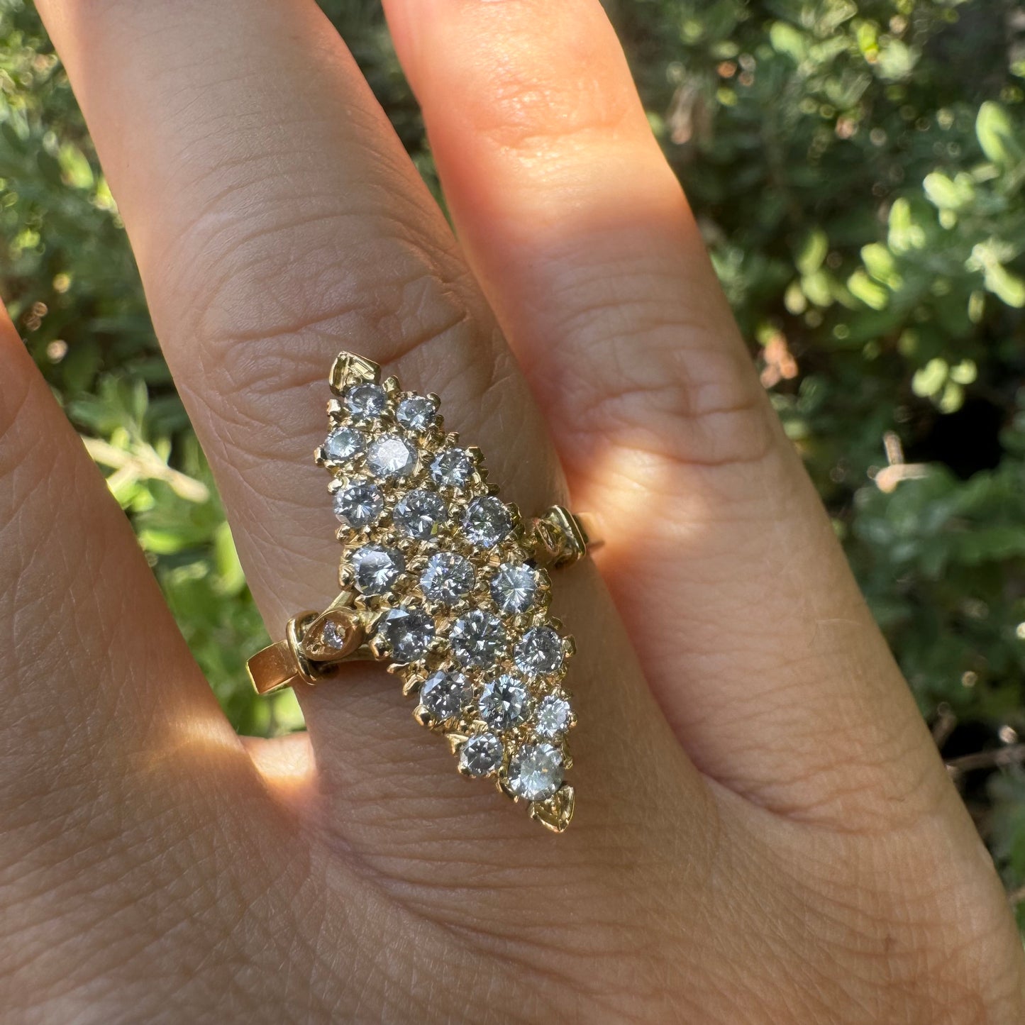 18K gold marquise-shaped ring set with multiple rows of sparkling Diamonds