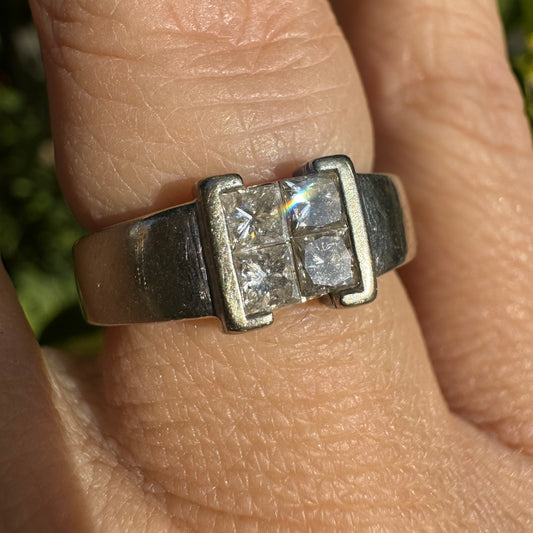 14K gold ring set with 4 square-cut Diamonds