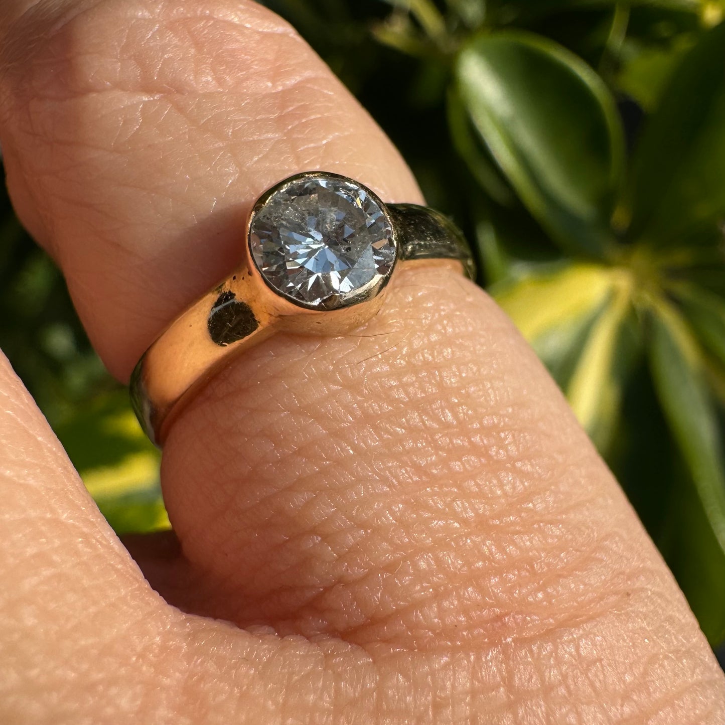 14K gold ring set with one center Diamond