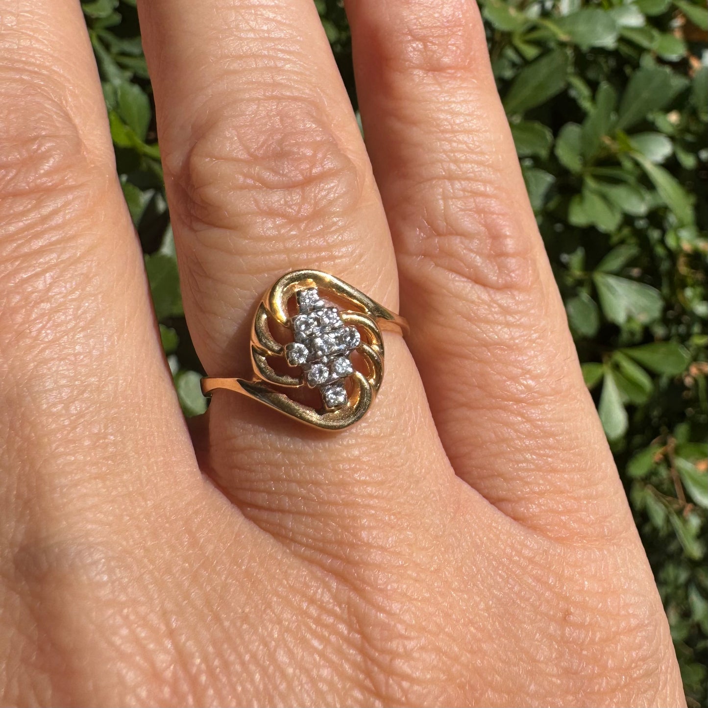 14K gold set with a cluster of sparkling Diamonds at its center