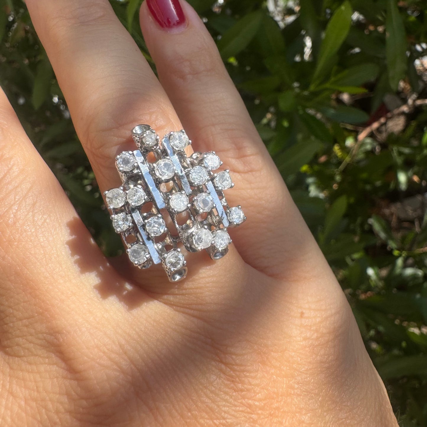 14K gold ring with a geometric design, set with multiple round Diamonds that create a sparkling, structured look.