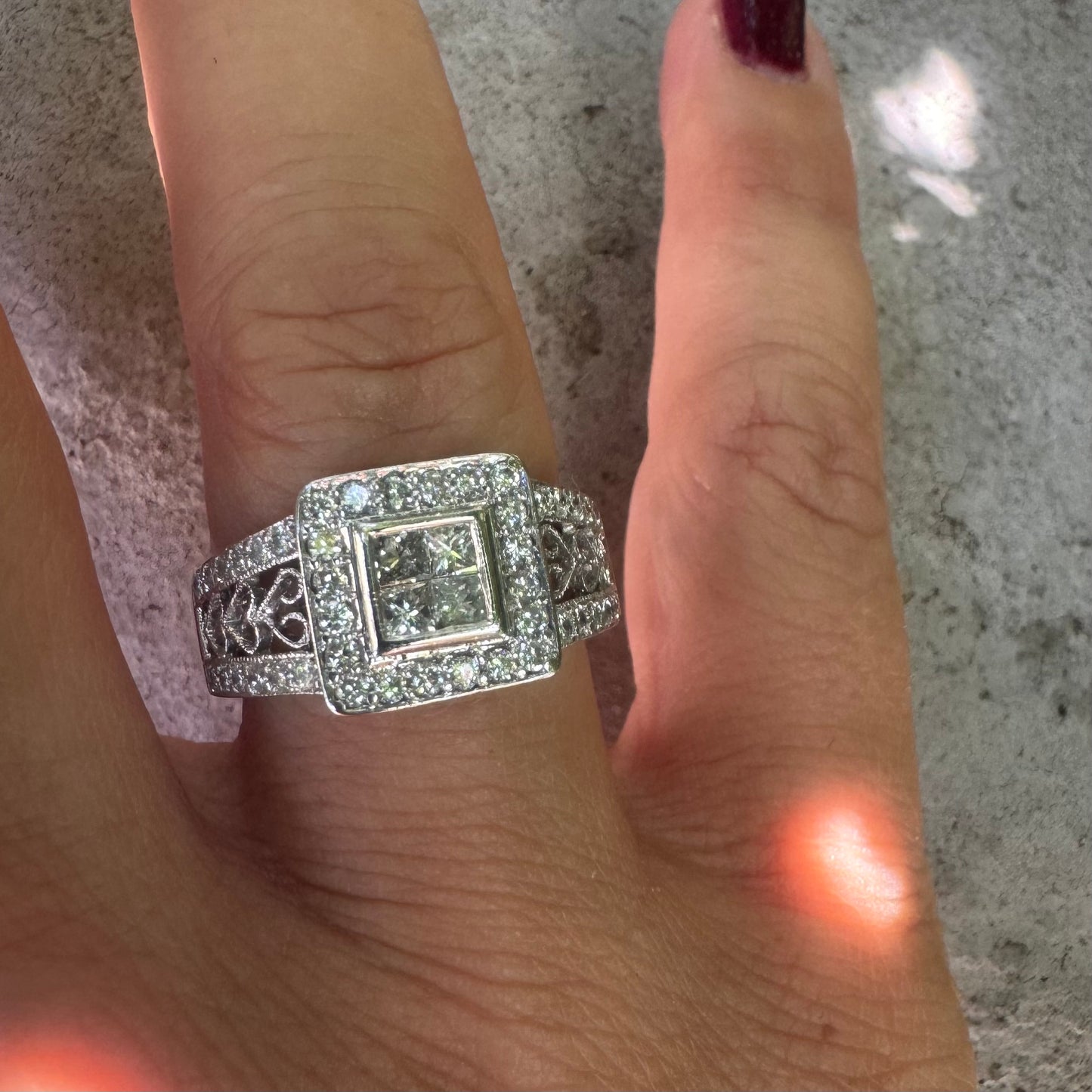 14K gold ring featuring a square cluster of princess-cut Diamonds in the center, surrounded by a double halo of smaller round Diamonds & gold details along the band.