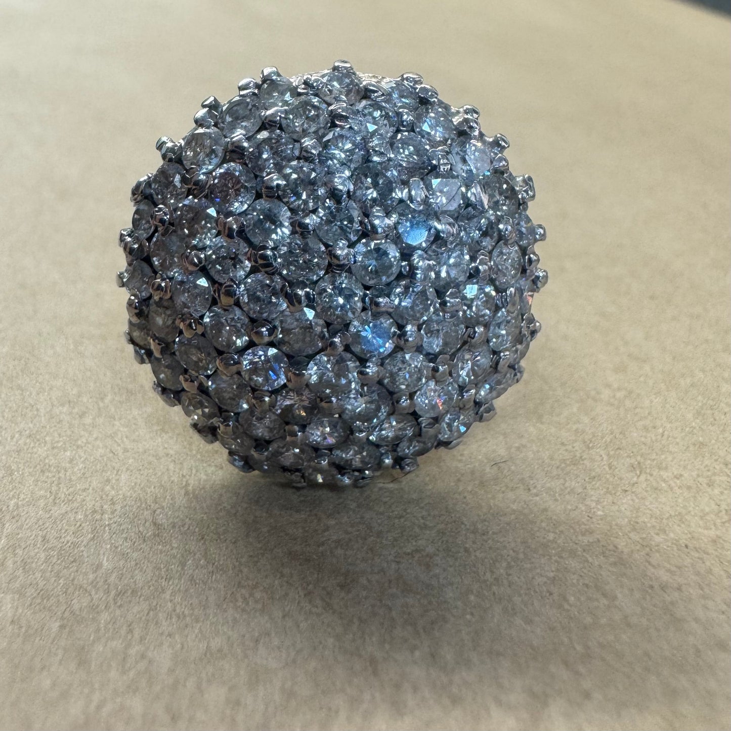 18K gold ring set with Diamonds in a bold pavé setting.