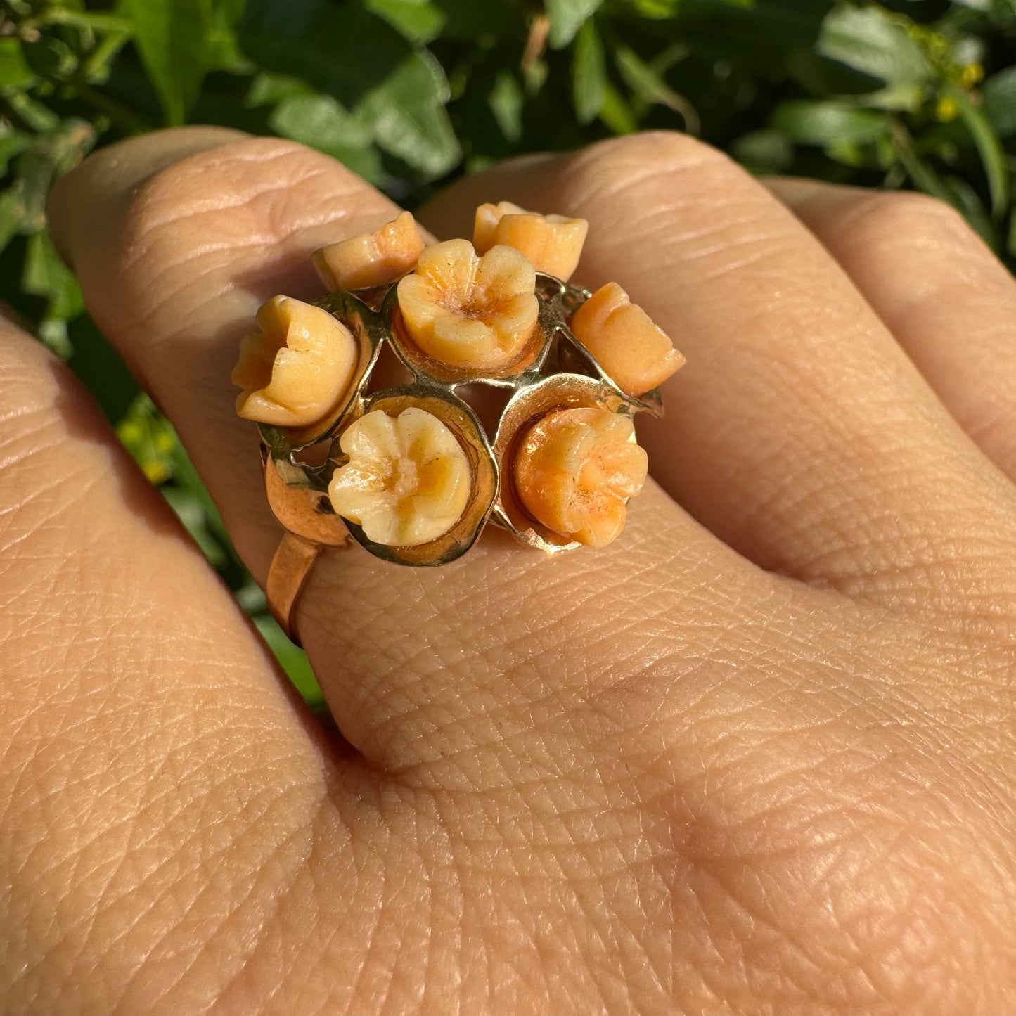 9K gold ring featuring a cluster design with carved Coral flowers in warm orange tones