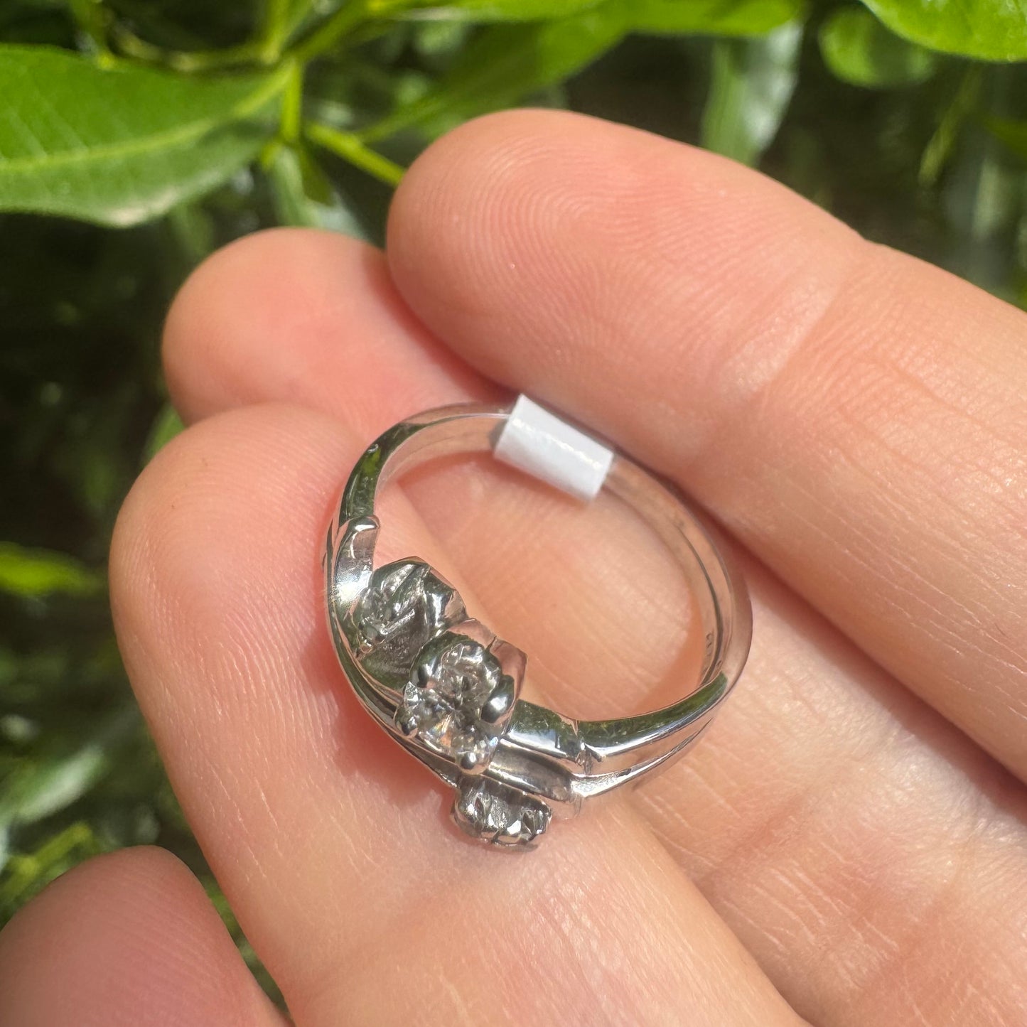 14K gold ring set with round-cut diamonds in a flowing design