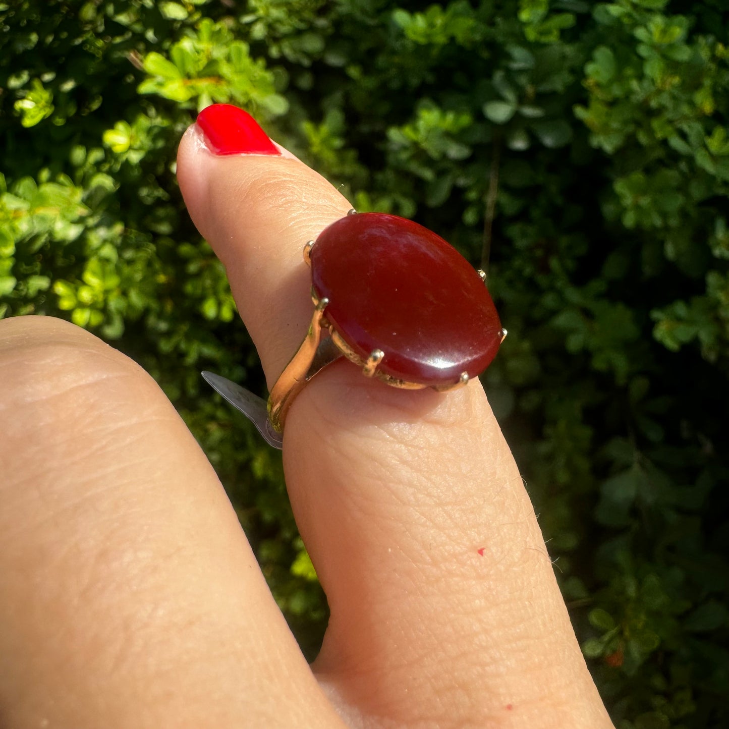 14K gold ring set with a glowing oval Carnelian