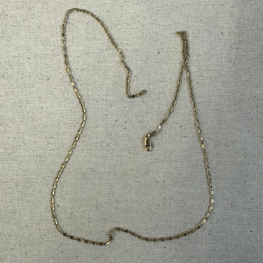 14K gold necklace featuring oval-shaped links with a subtle decorative pattern.