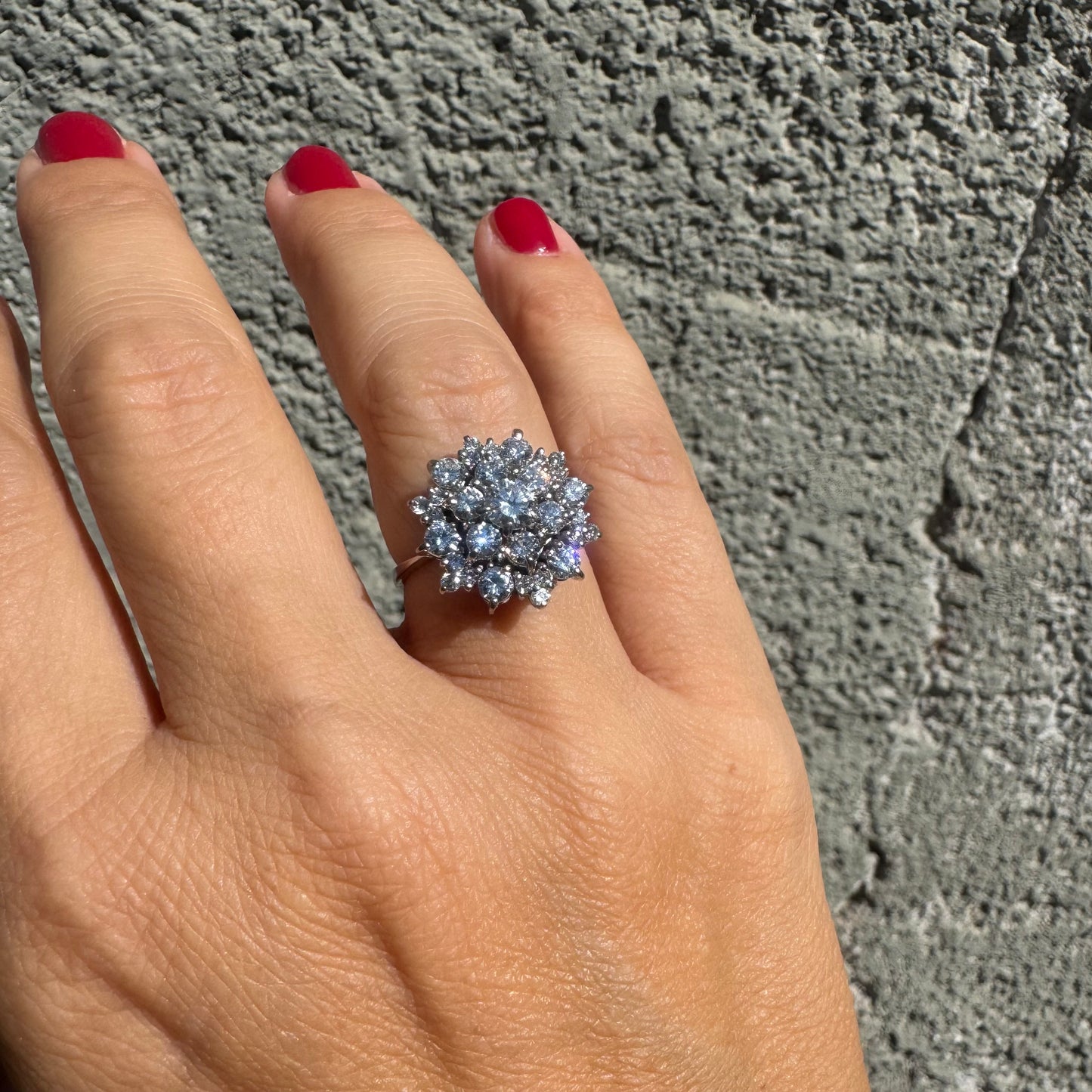 18K gold ring set with sparkling white Diamonds arranged in a floral cluster design