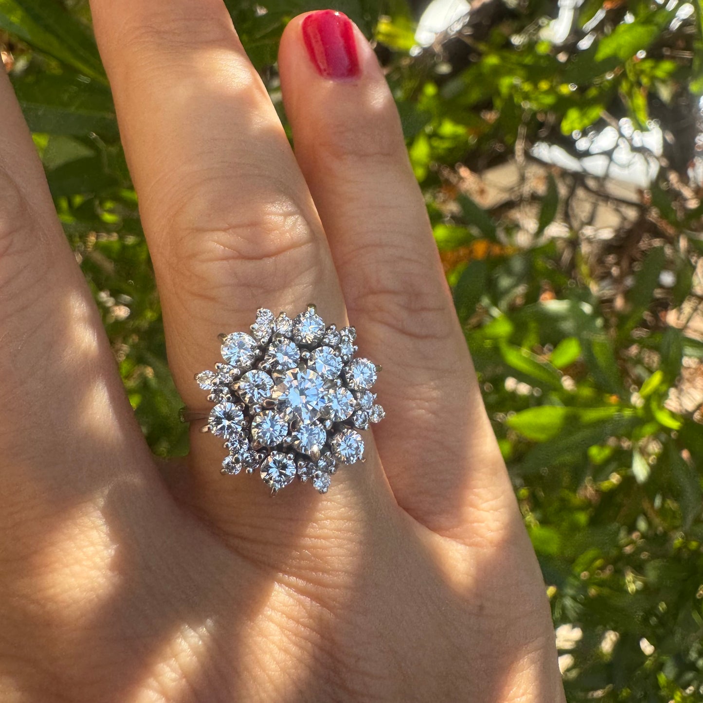 18K gold ring set with sparkling white Diamonds arranged in a floral cluster design