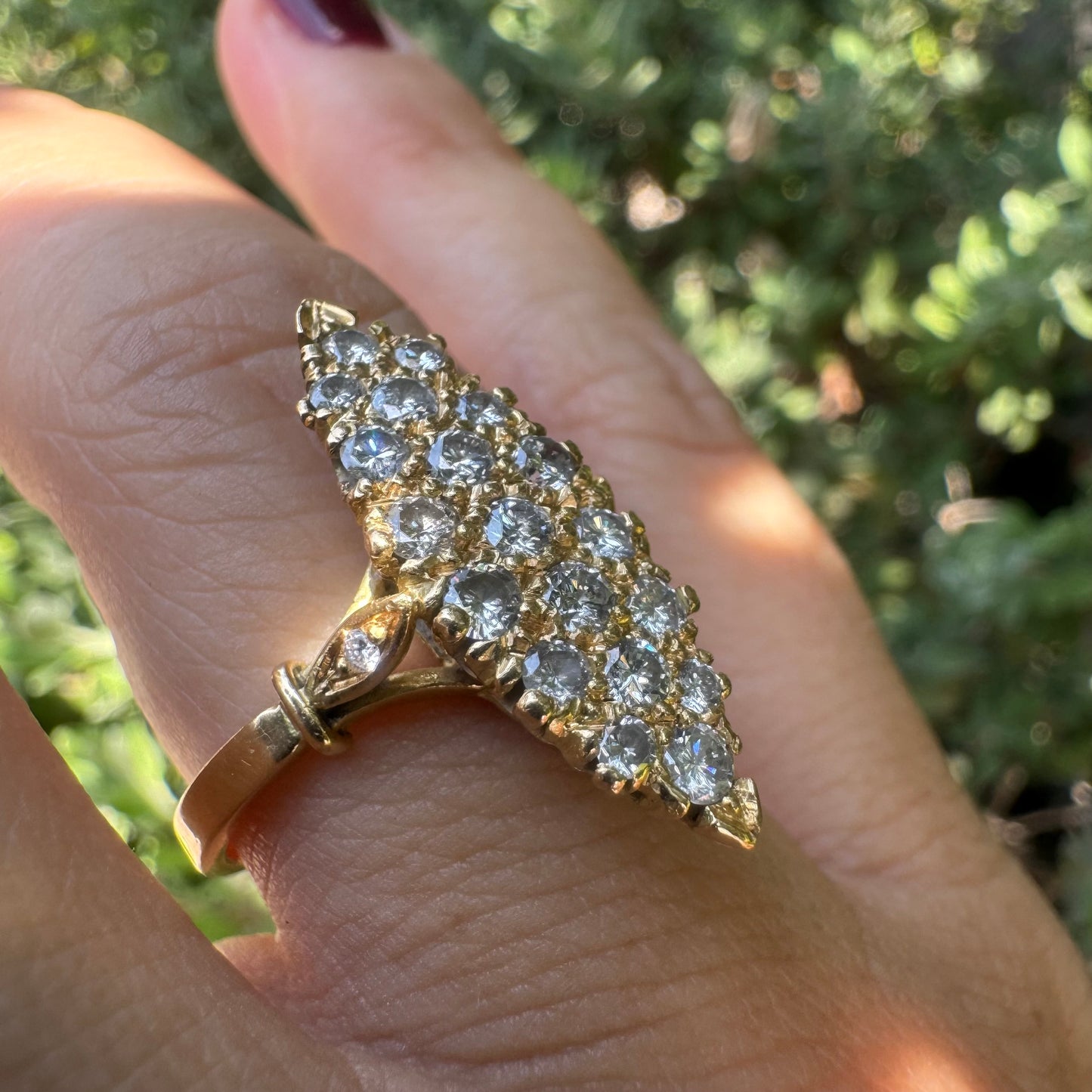 18K gold marquise-shaped ring set with multiple rows of sparkling Diamonds