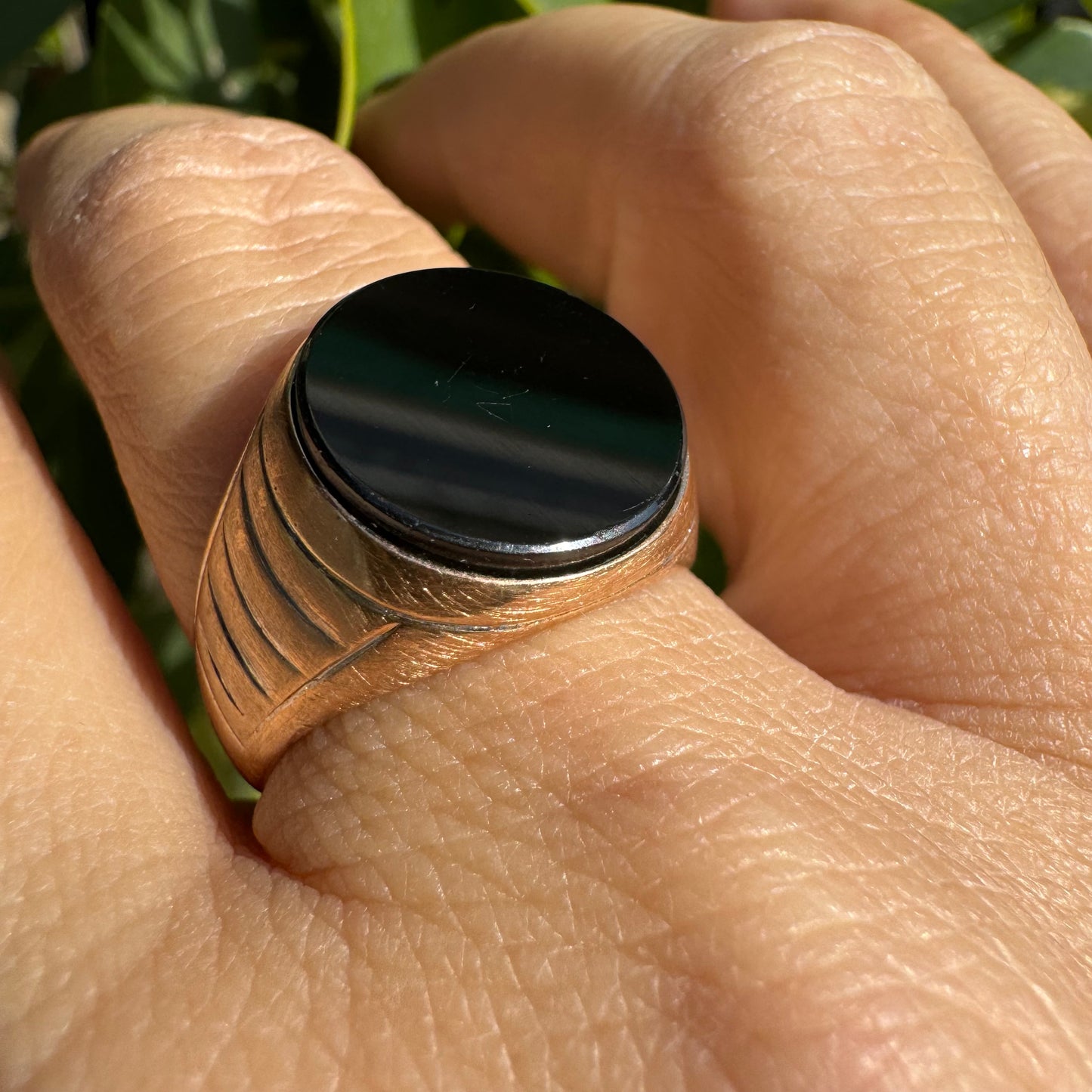 14K gold signet ring crafted in yellow gold, set with a smooth Black Onyx.
