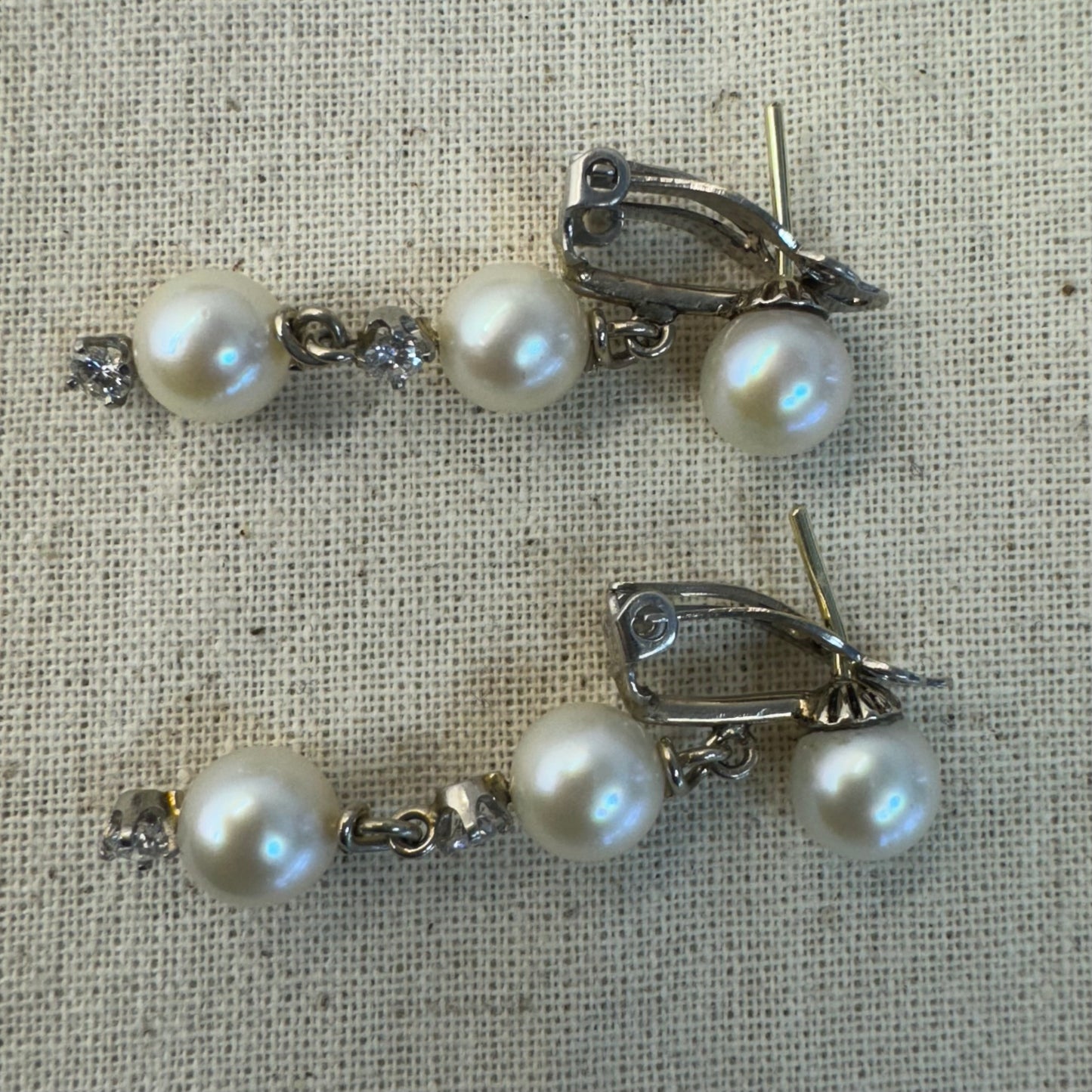 14K gold elegant drop earring set with three soft creamy Pearls connected by round brilliant Diamonds