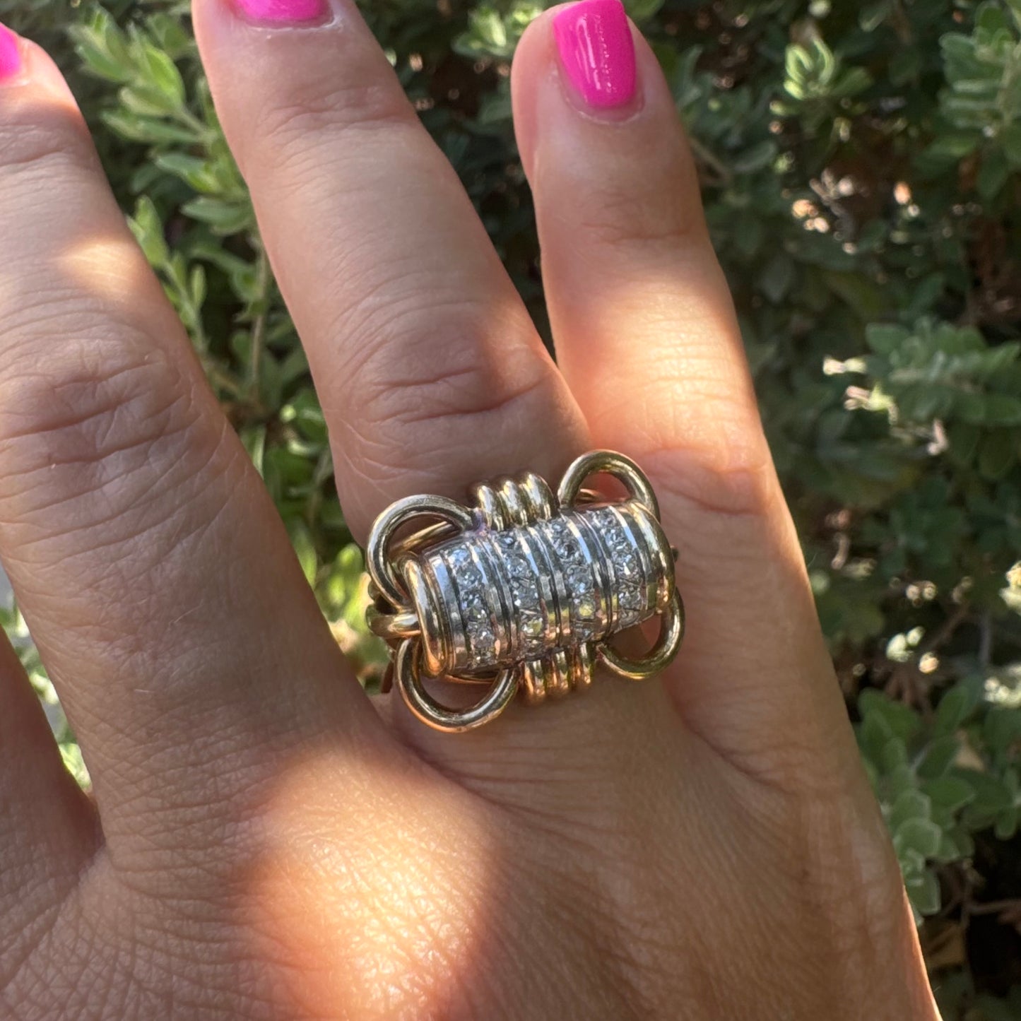 18K gold ring with a barrel-shaped centerpiece, crafted in yellow and white gold and set with sparkling Diamonds.