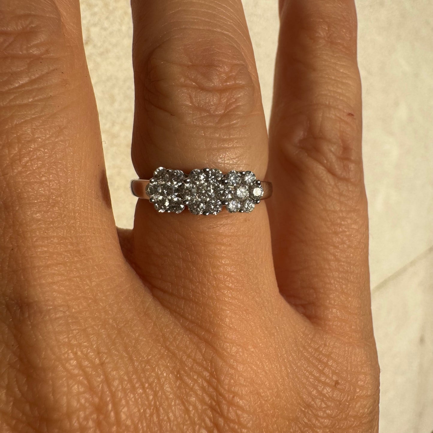 14K white gold ring set with clusters of brilliant white Diamonds