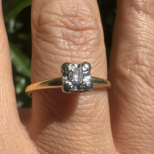 14K gold solitaire ring set with a small round Diamond