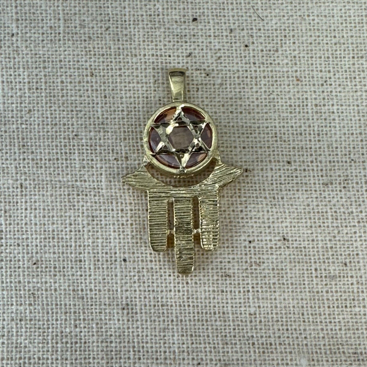 14K gold Hamsa pendant, featuring a deep orange gemstone framed by a Star of David.
