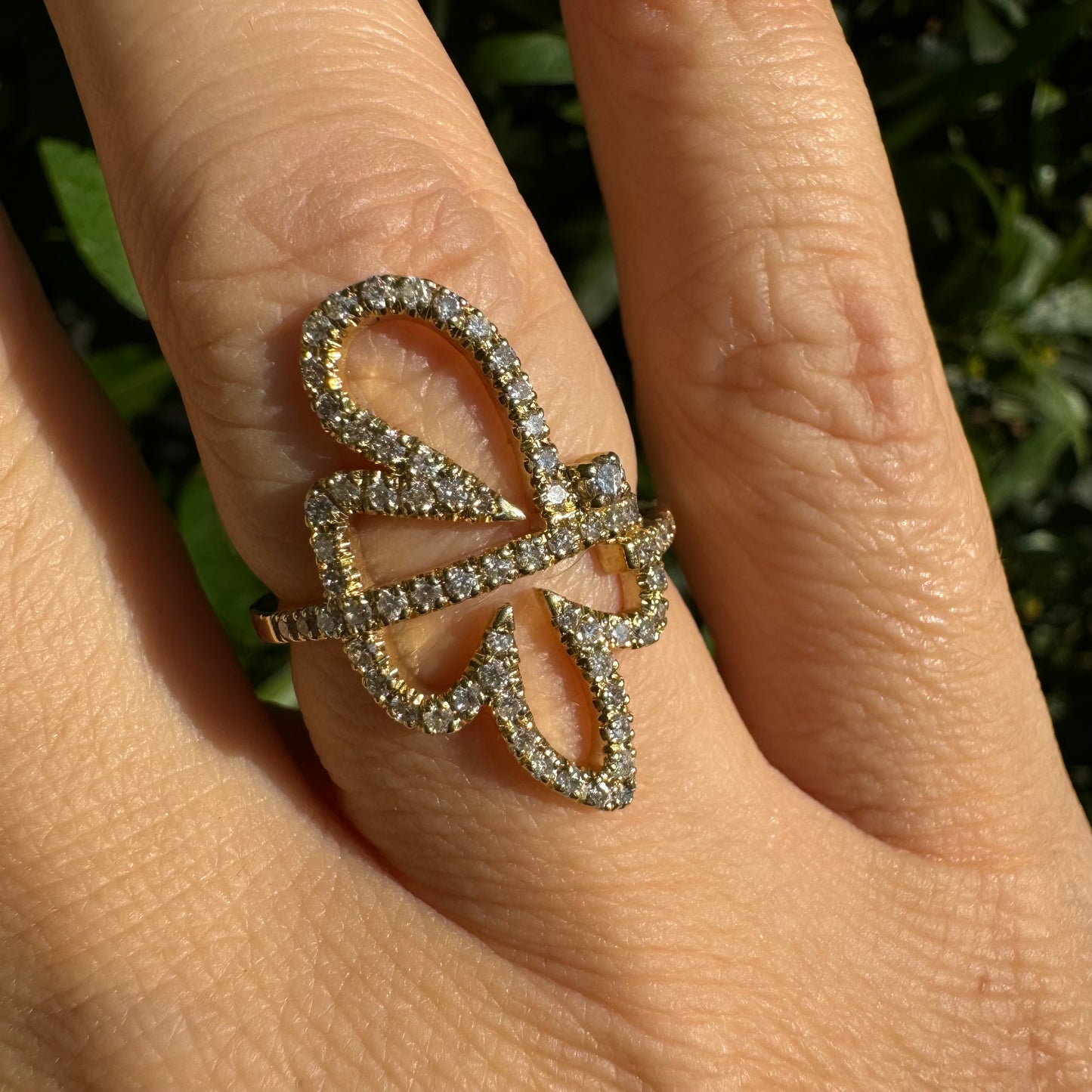 14K gold ring in an open butterfly design, outlined with sparkling Diamonds