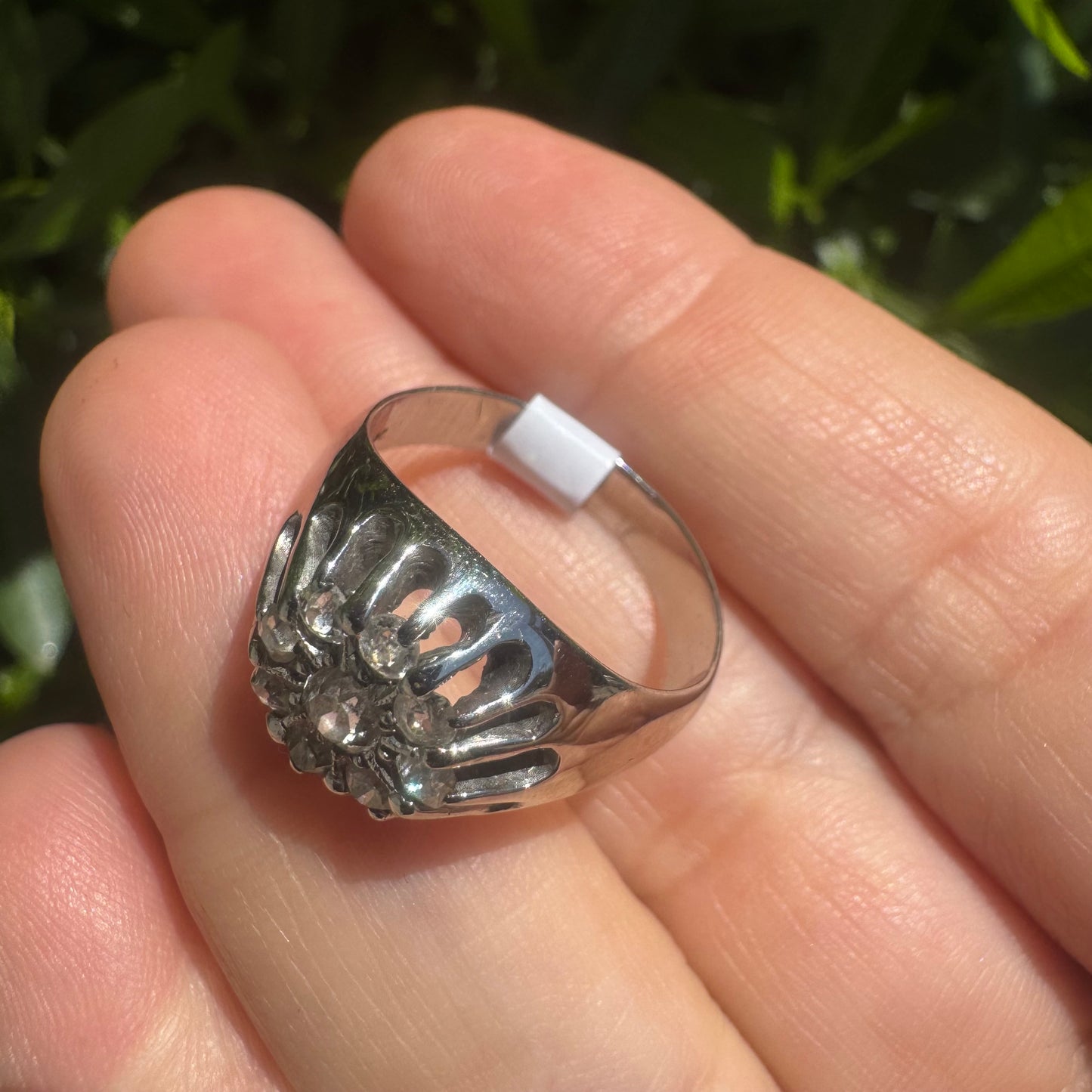 14K gold ring set with a cluster of old cut diamonds arranged in a floral design