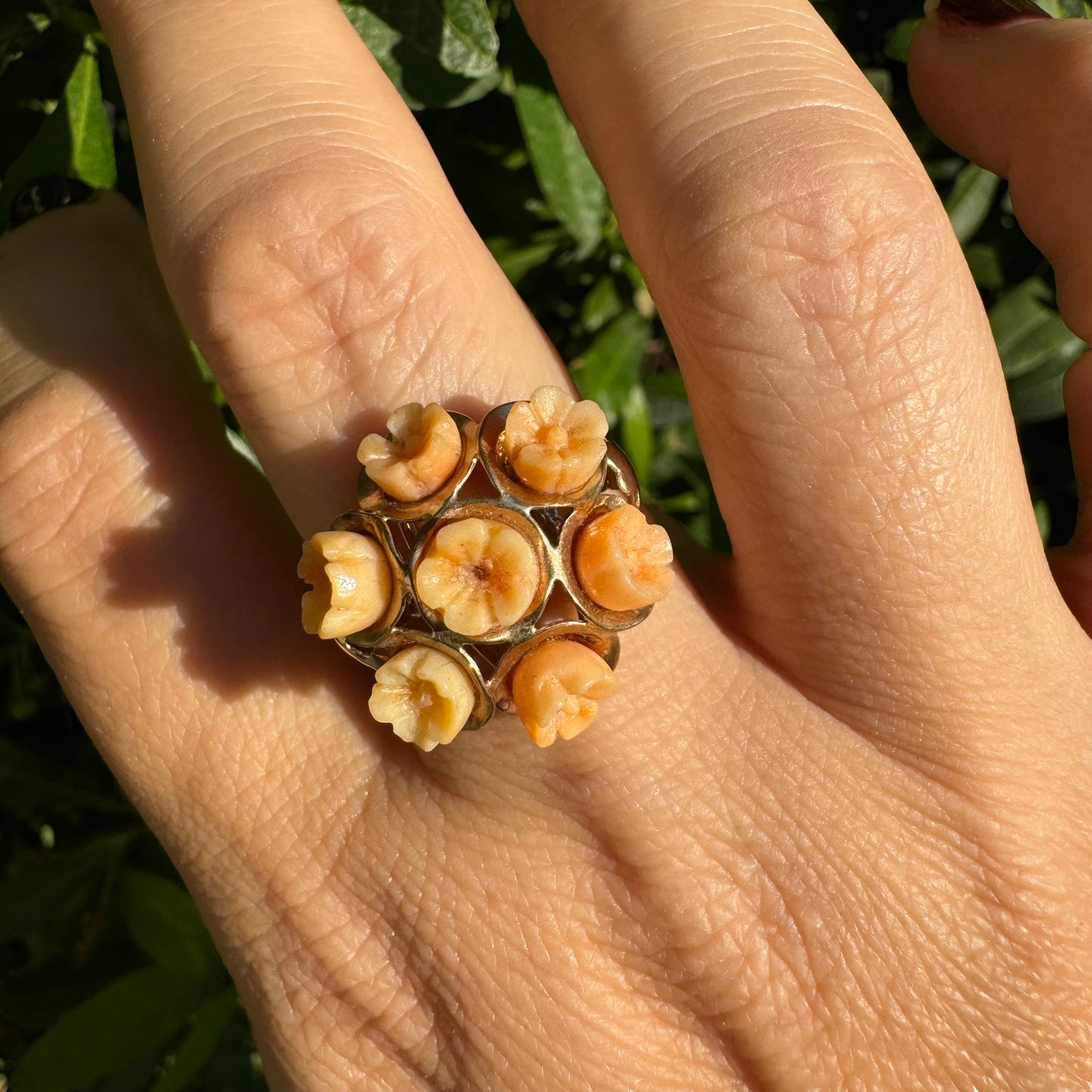 9K gold ring featuring a cluster design with carved Coral flowers in warm orange tones