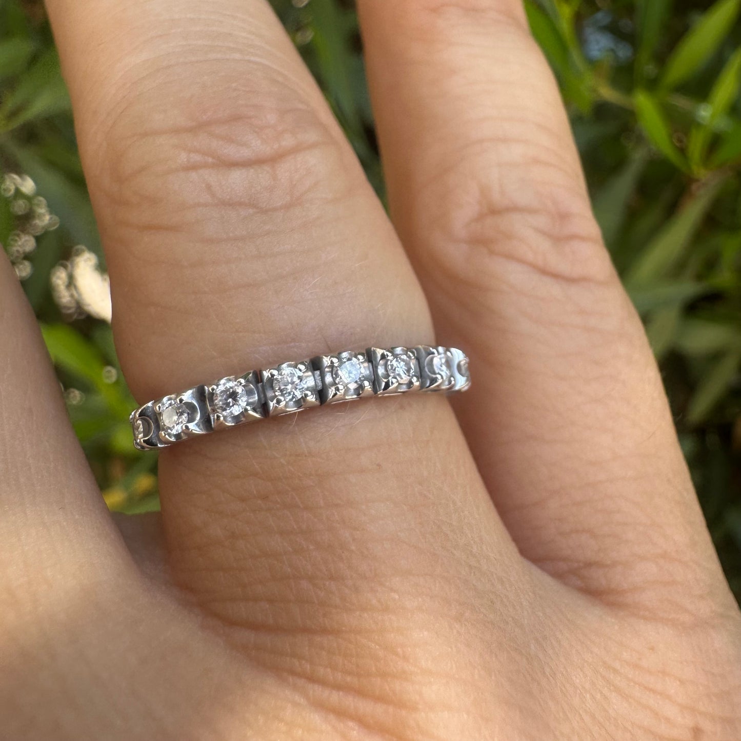 14K gold ring set with a row of sparkling Diamonds