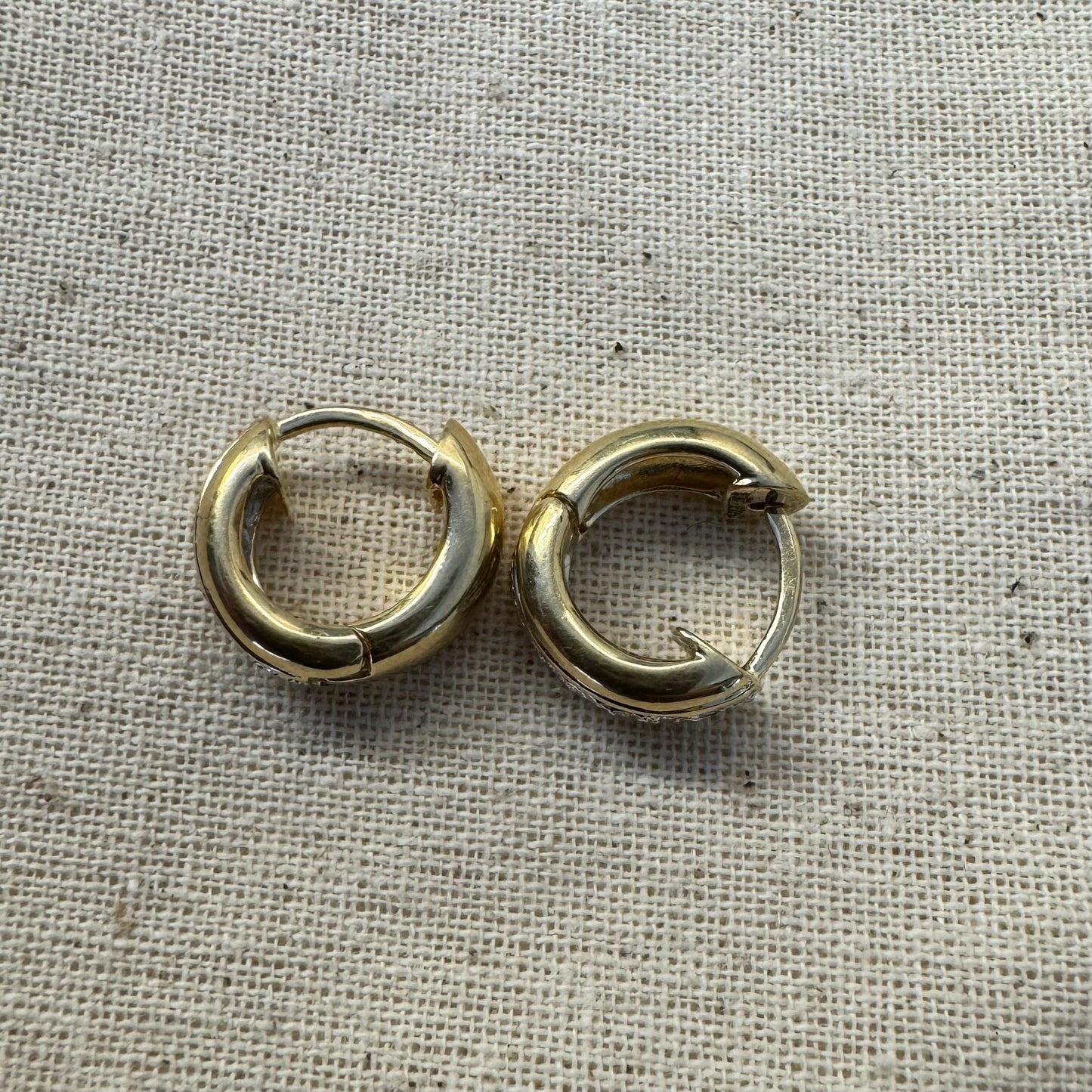 14K gold hoop earrings set with a row of sparkling Diamonds in a sleek channel setting