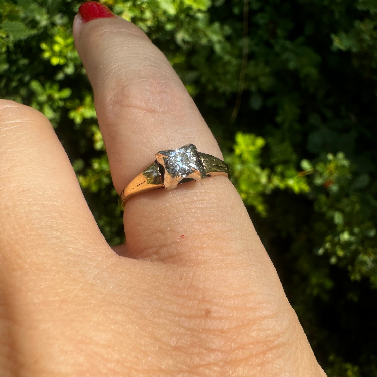 14K gold ring set with one center Diamond