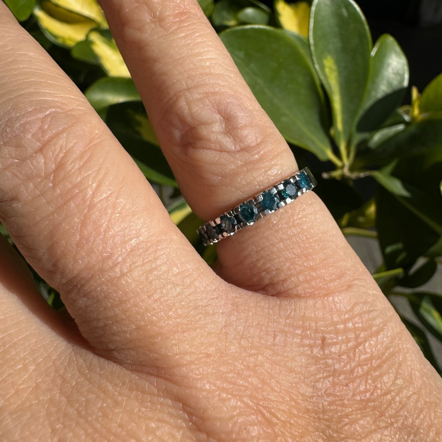 14K gold ring set with blue Diamonds