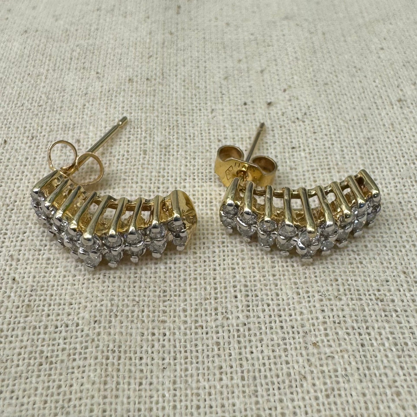 14K gold half-hoop earrings set with sparkling Diamonds in a dense pavé setting