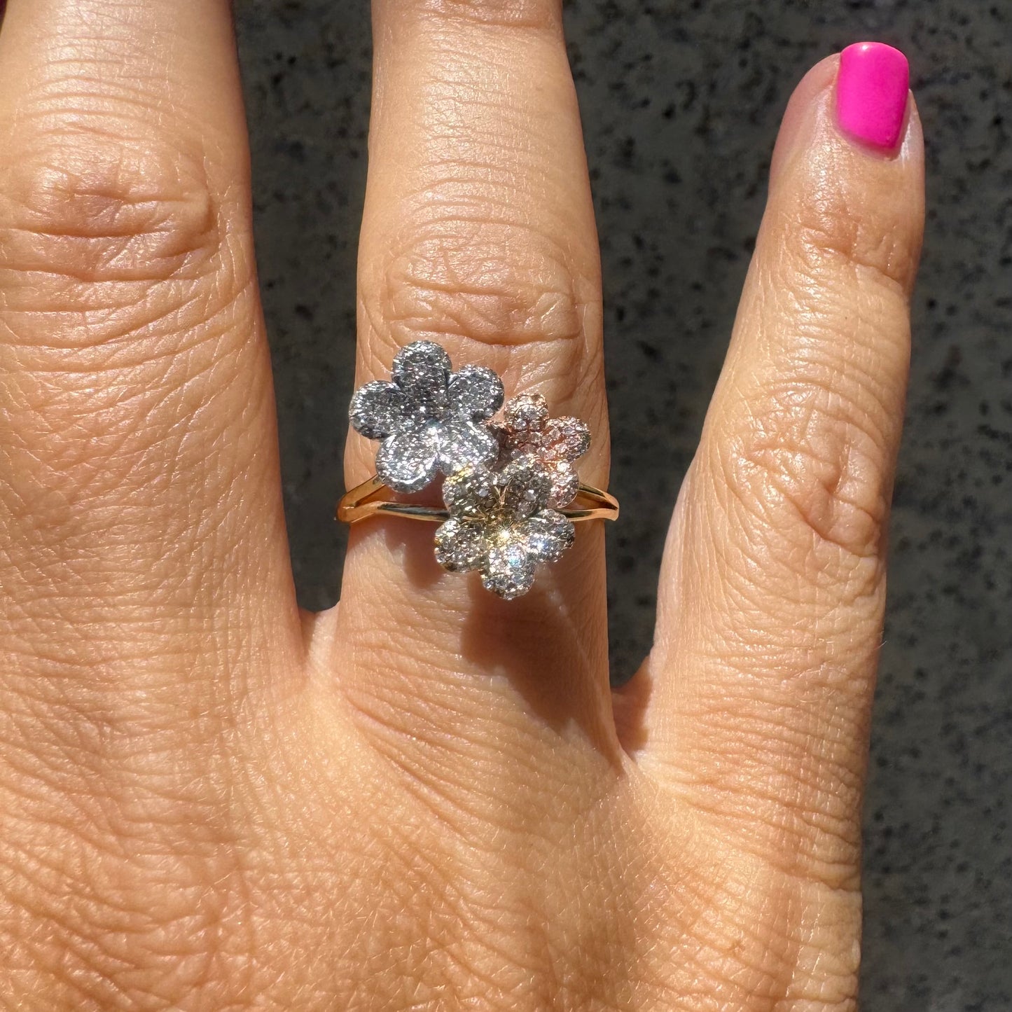 14K gold trio ring featuring white, yellow & rose gold blossoms, each encrusted with sparkling Diamonds.