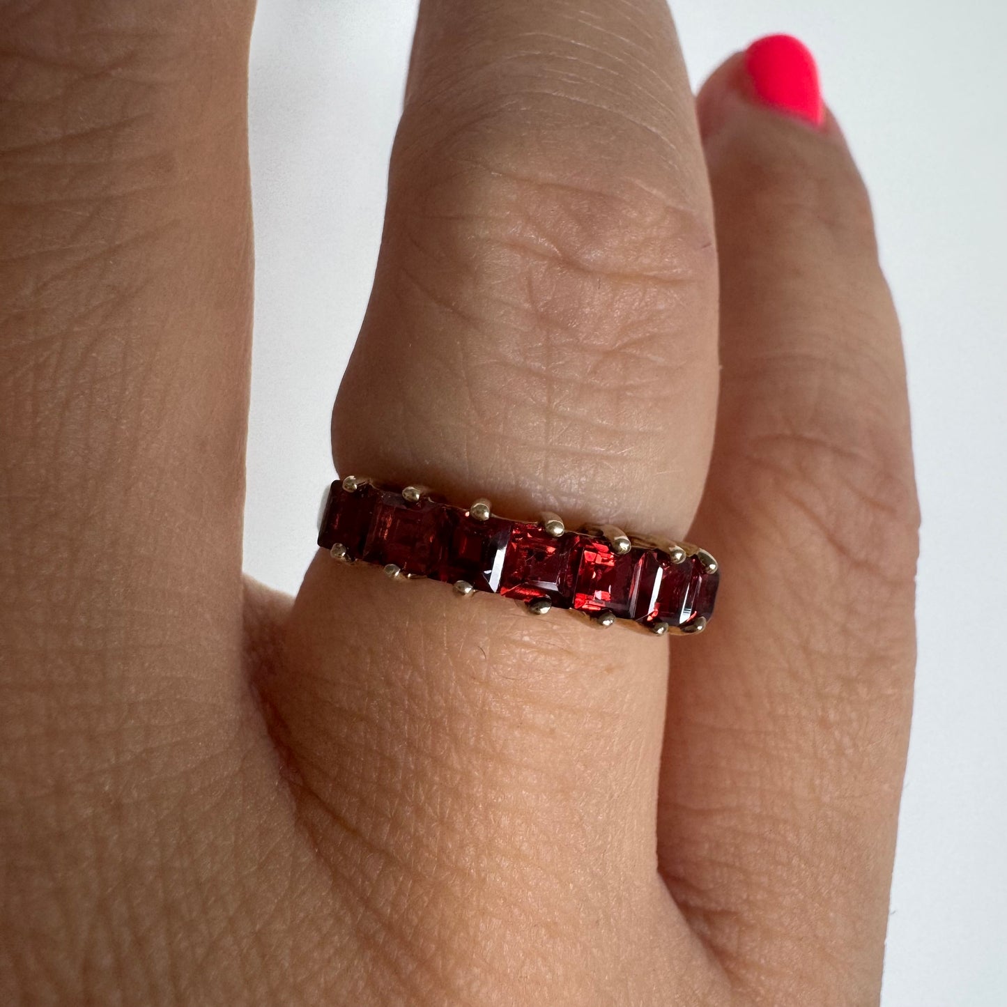 9K gold ring set with deep red garnets