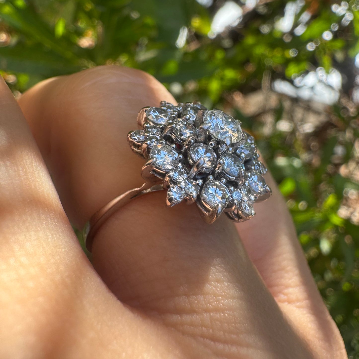 18K gold ring set with sparkling white Diamonds arranged in a floral cluster design