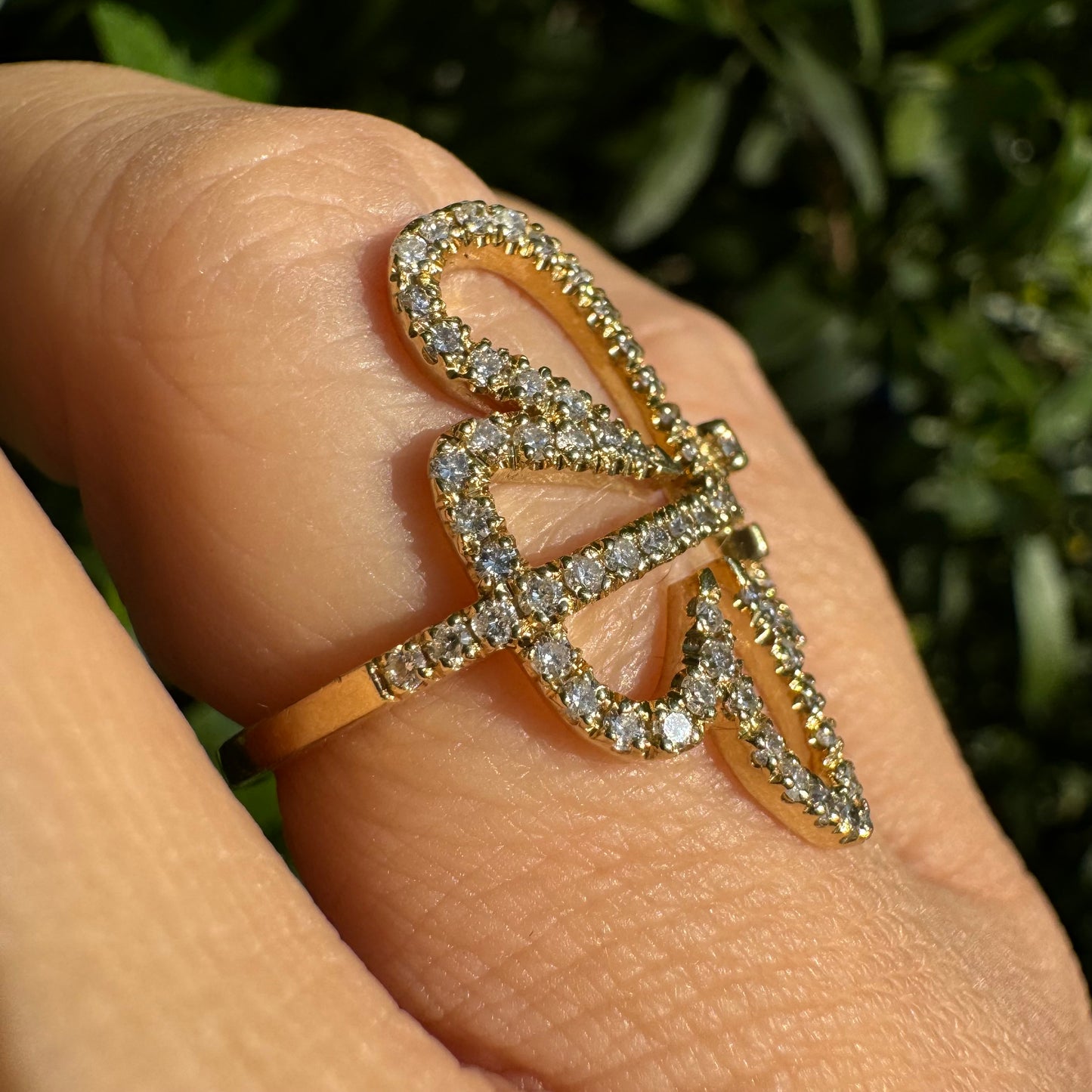 14K gold ring in an open butterfly design, outlined with sparkling Diamonds