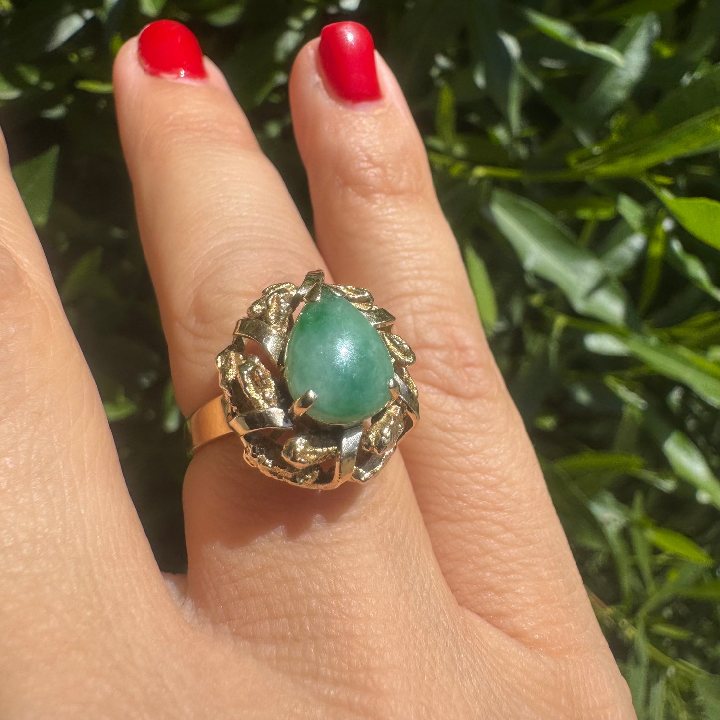 14K gold ring set with a pear-shaped Jade cabochon